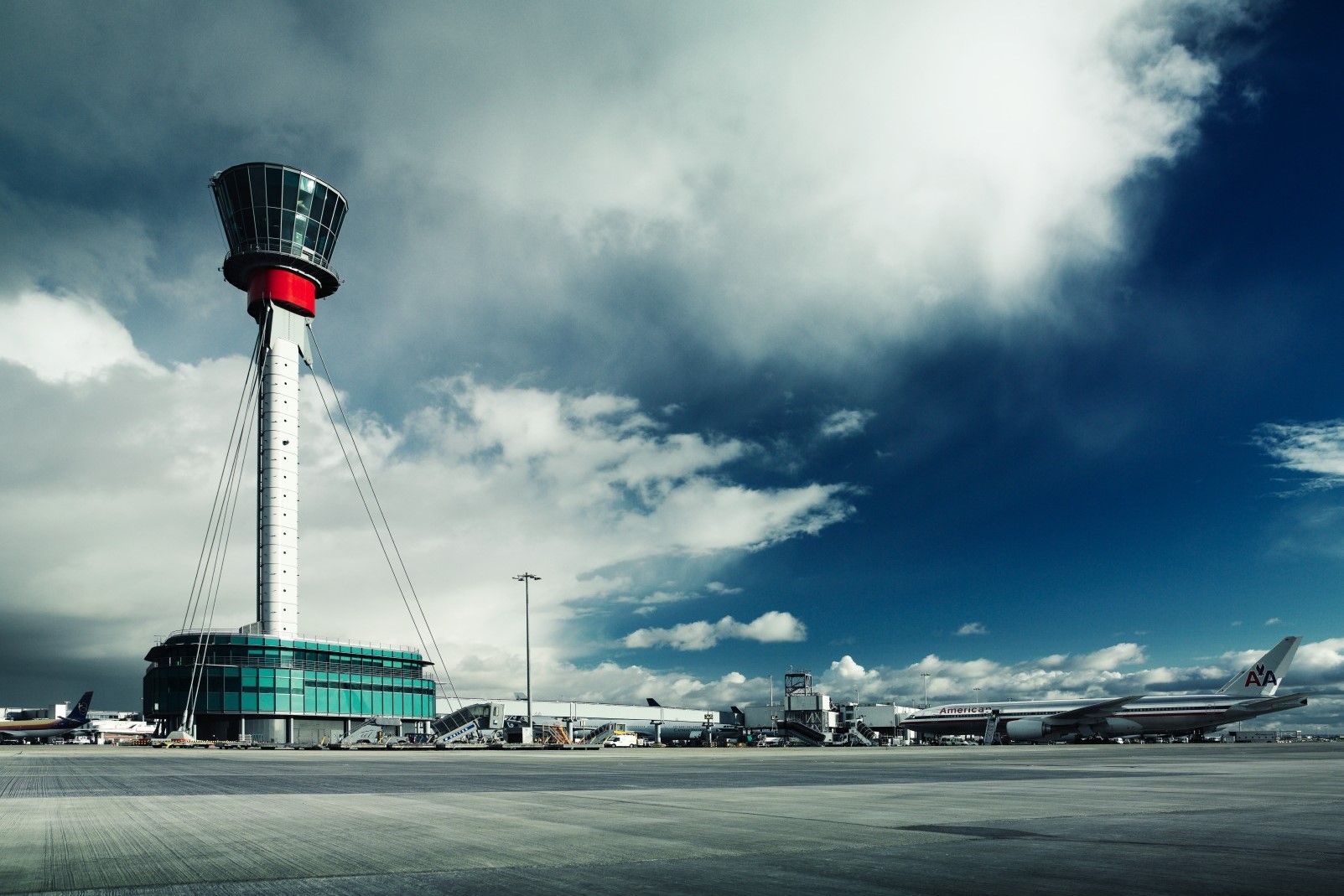 A Panoramic view of London Heathrow Airport with its Air Traffic Control Tower prominently in the view.