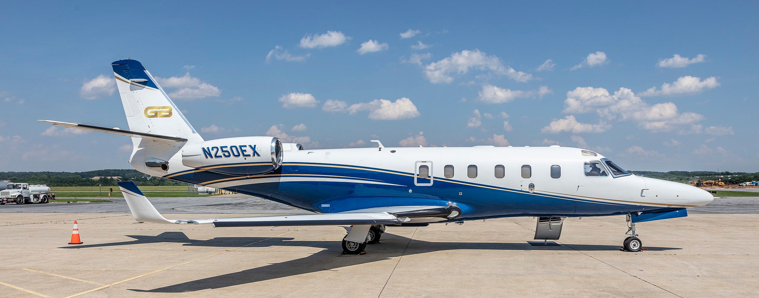 A Gulfstream G100 parked on an airport apron.