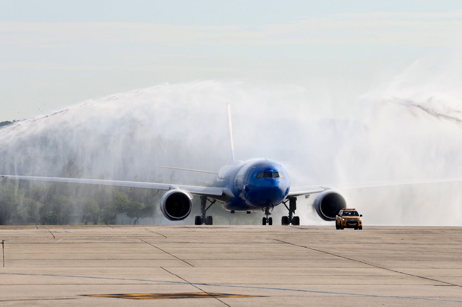 An ITA Airways A330neo receiving a water salute in Rio de Janeiro
