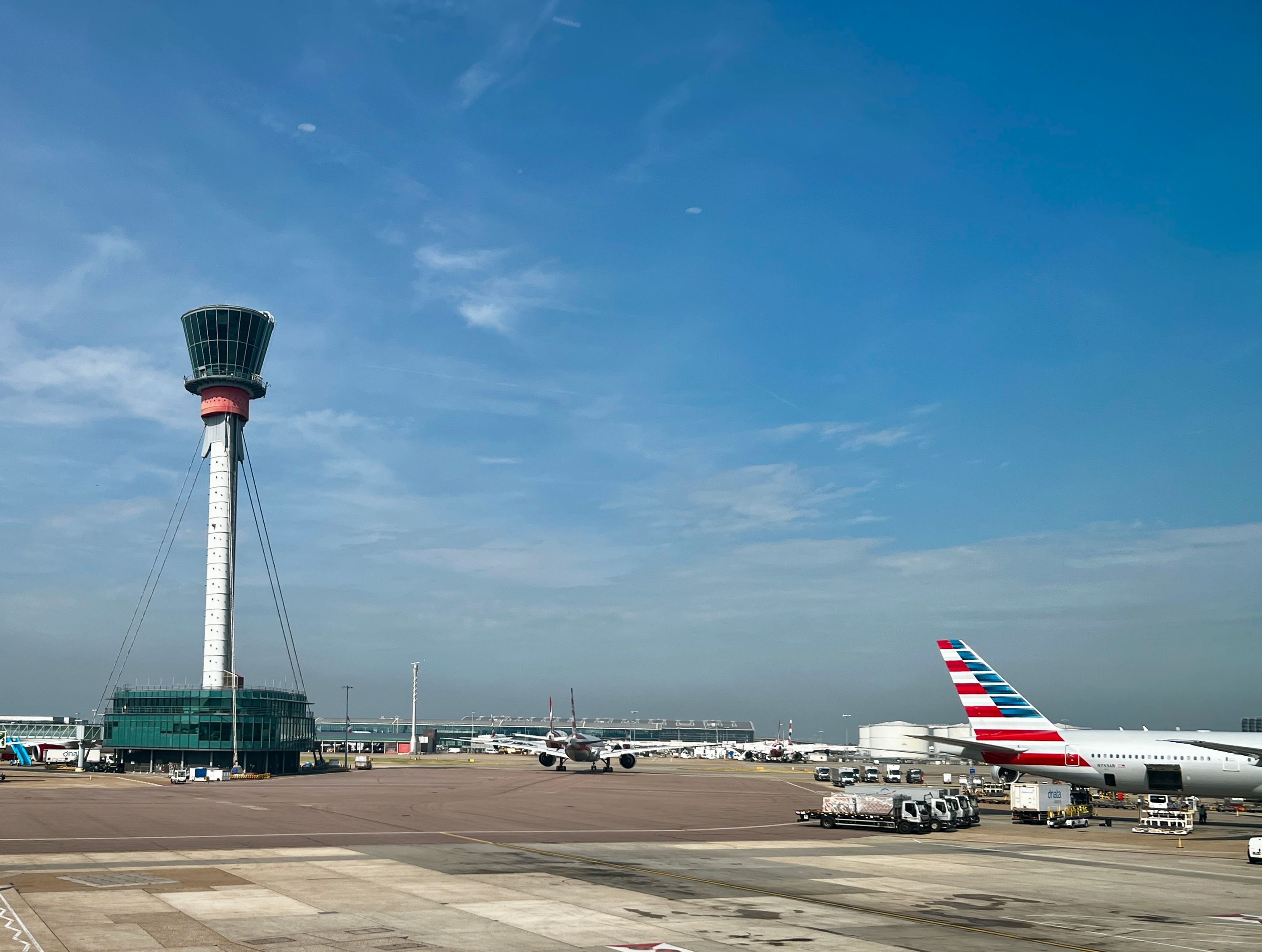 An American Airlines plane near the Control Tower at London Heathrow Airport.