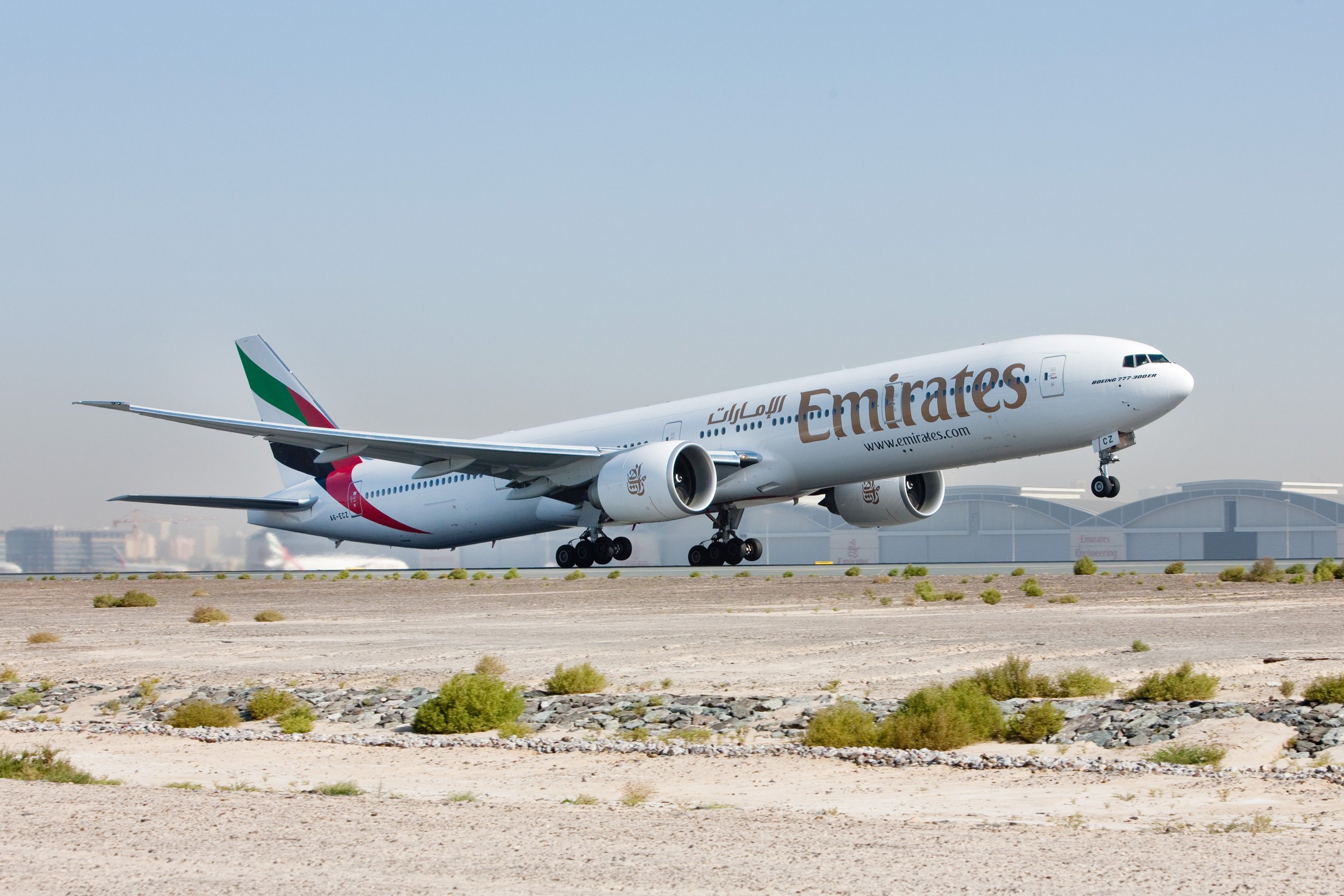 Emirates Boeing 777-300ER taking off in clear skies