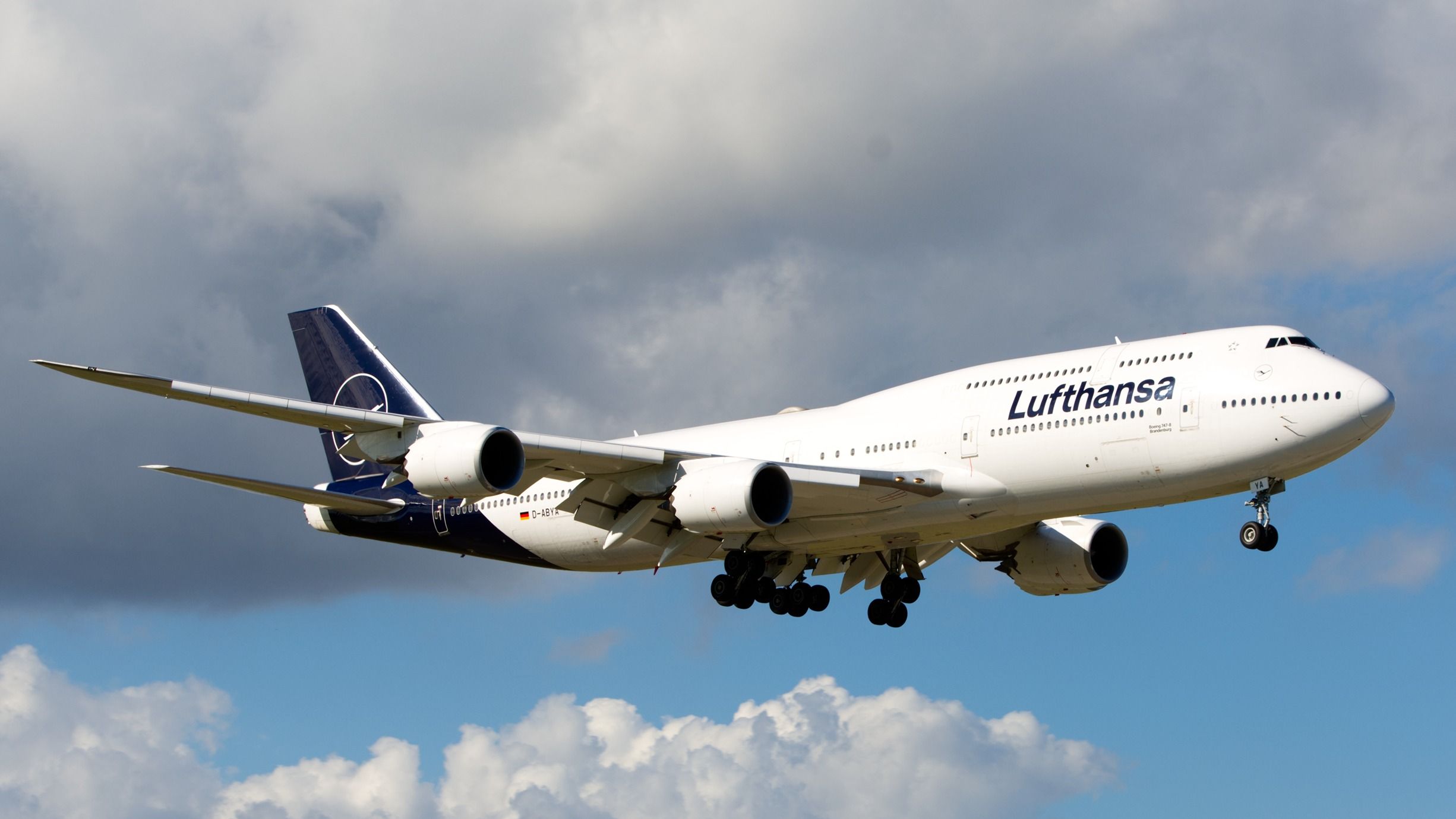 A Lufthansa Boeing 747-8 flying in the sky.