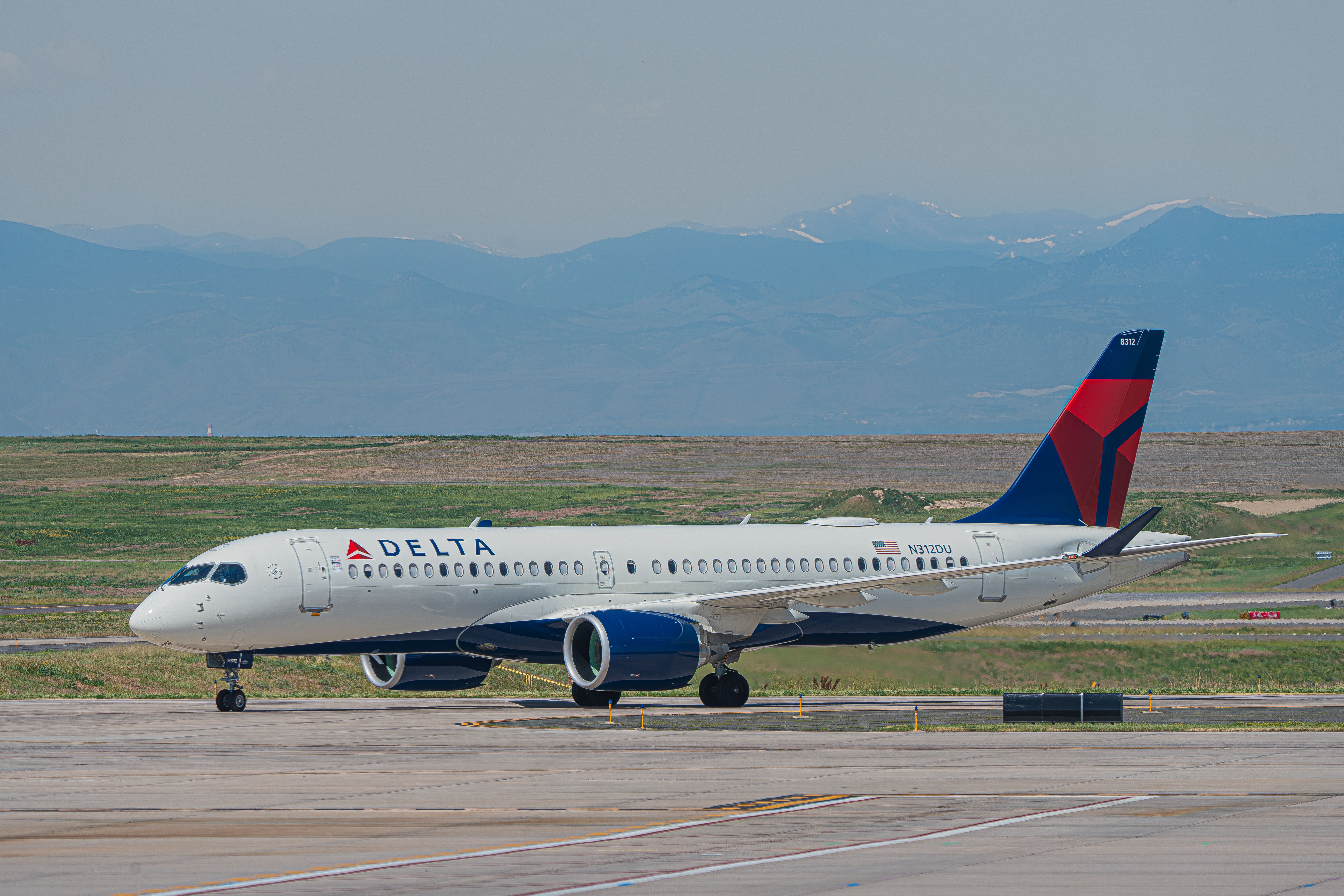Delta Air Lines Airbus A220-300 (N312DU) taxiing at Denver International Airport, July 2023.