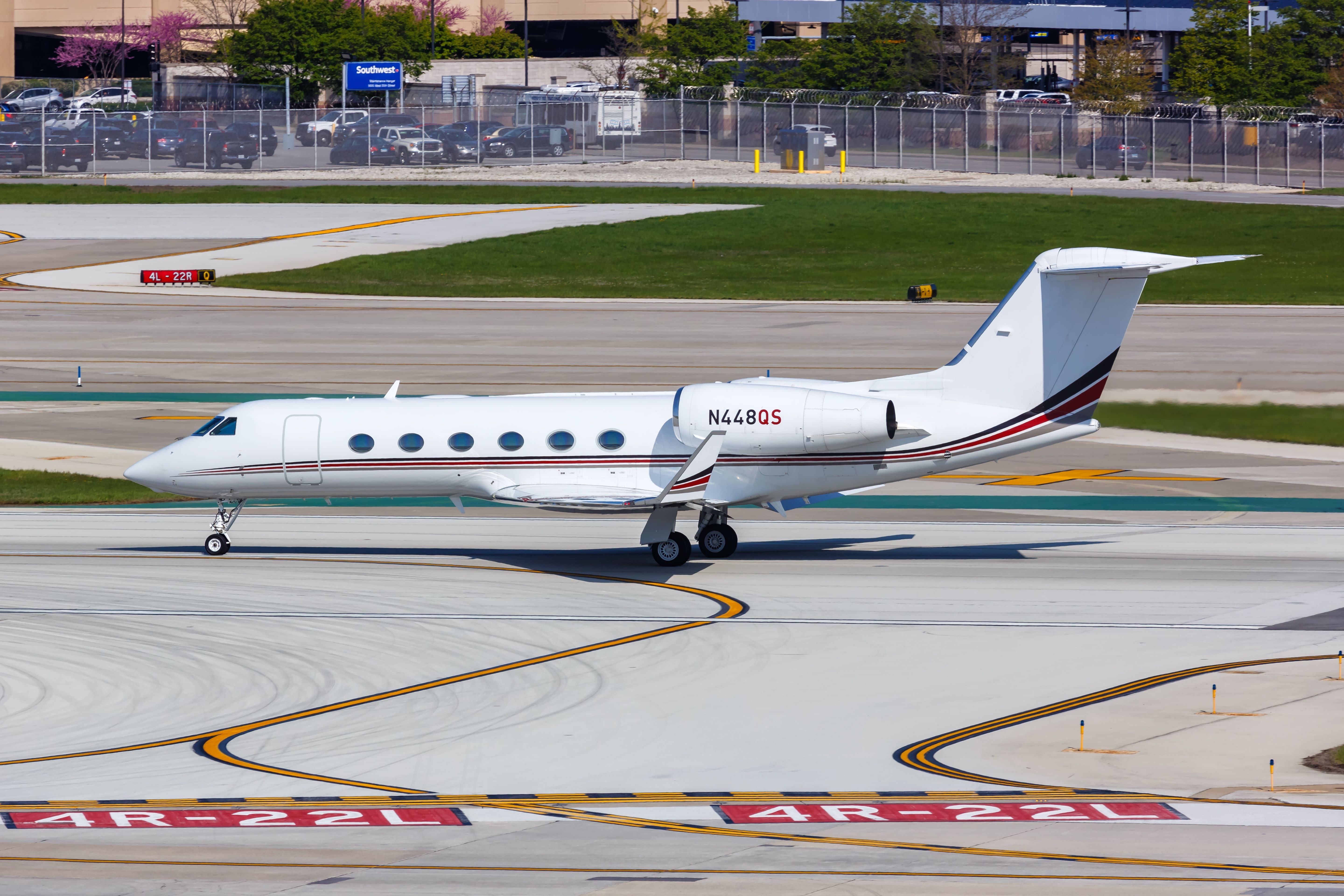 A NetJets Gulfstream G450 on an airport apron.