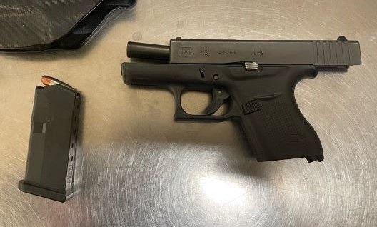 Gun on TSA table.