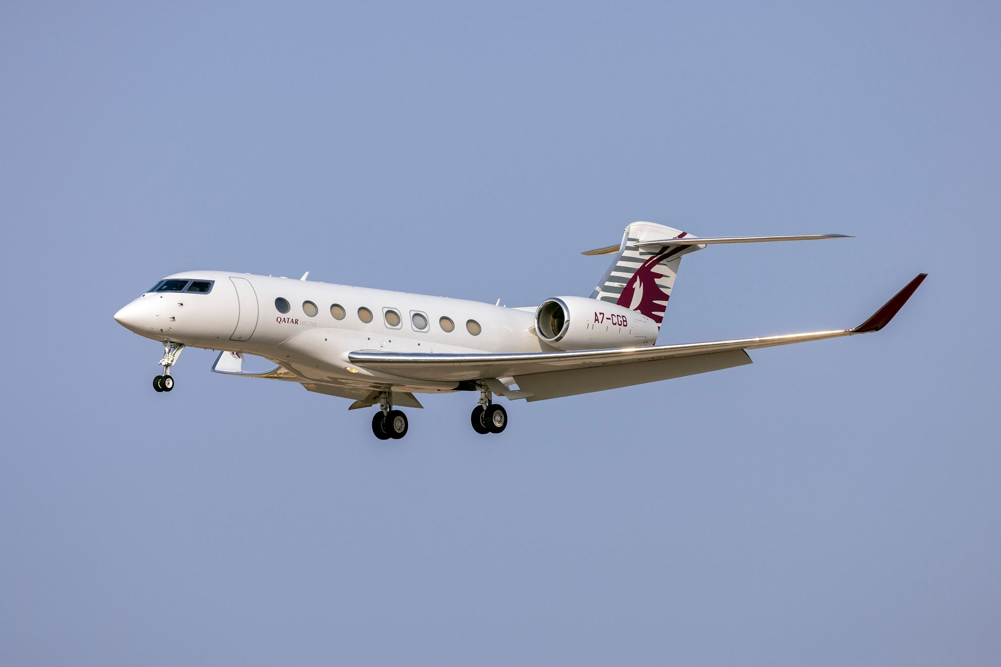 A Qatar Executive Gulfstream G650ER flying in the sky.