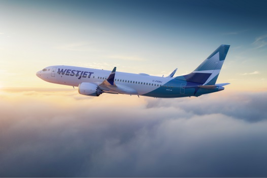 WestJet Boeing 737 flying above the clouds