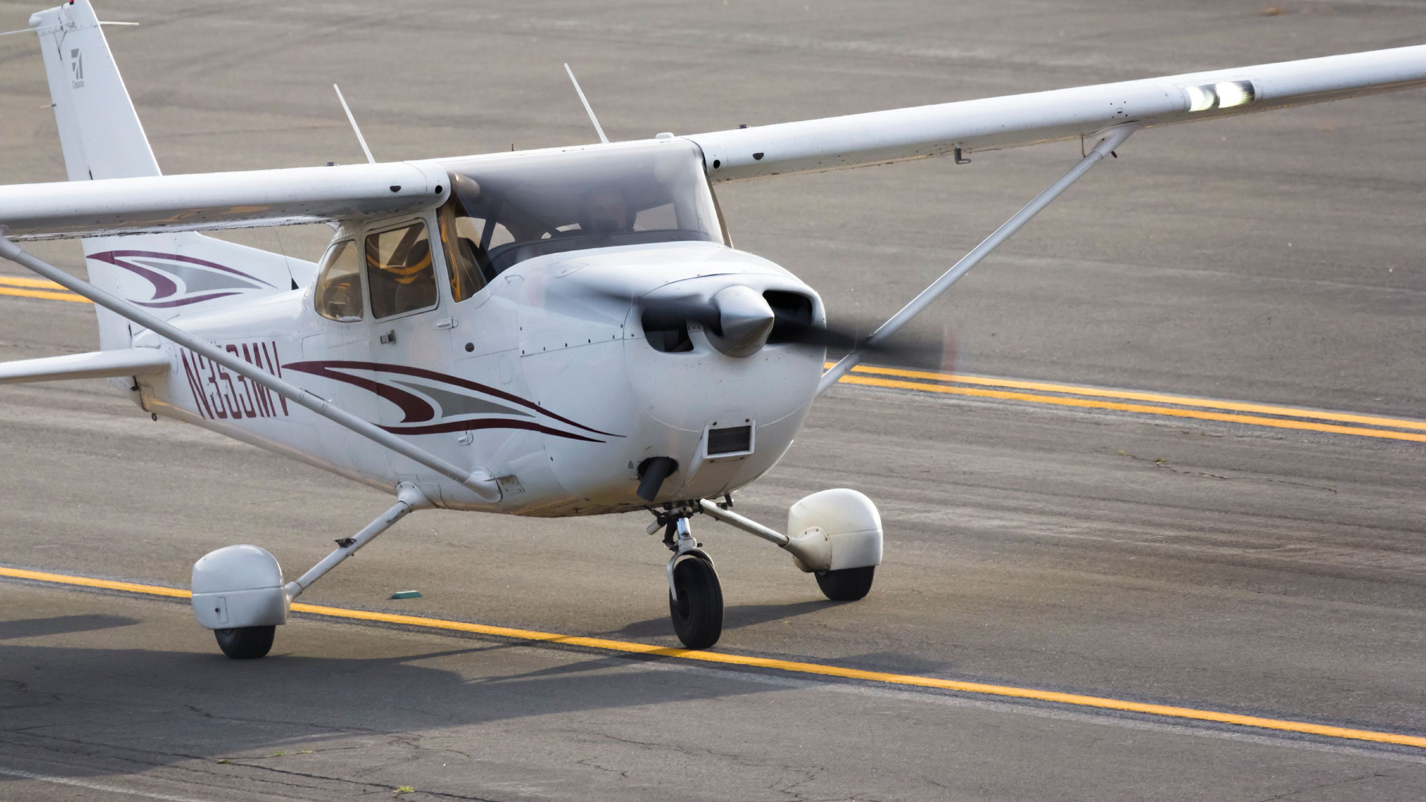 A Cessna 172 on an airport apron.