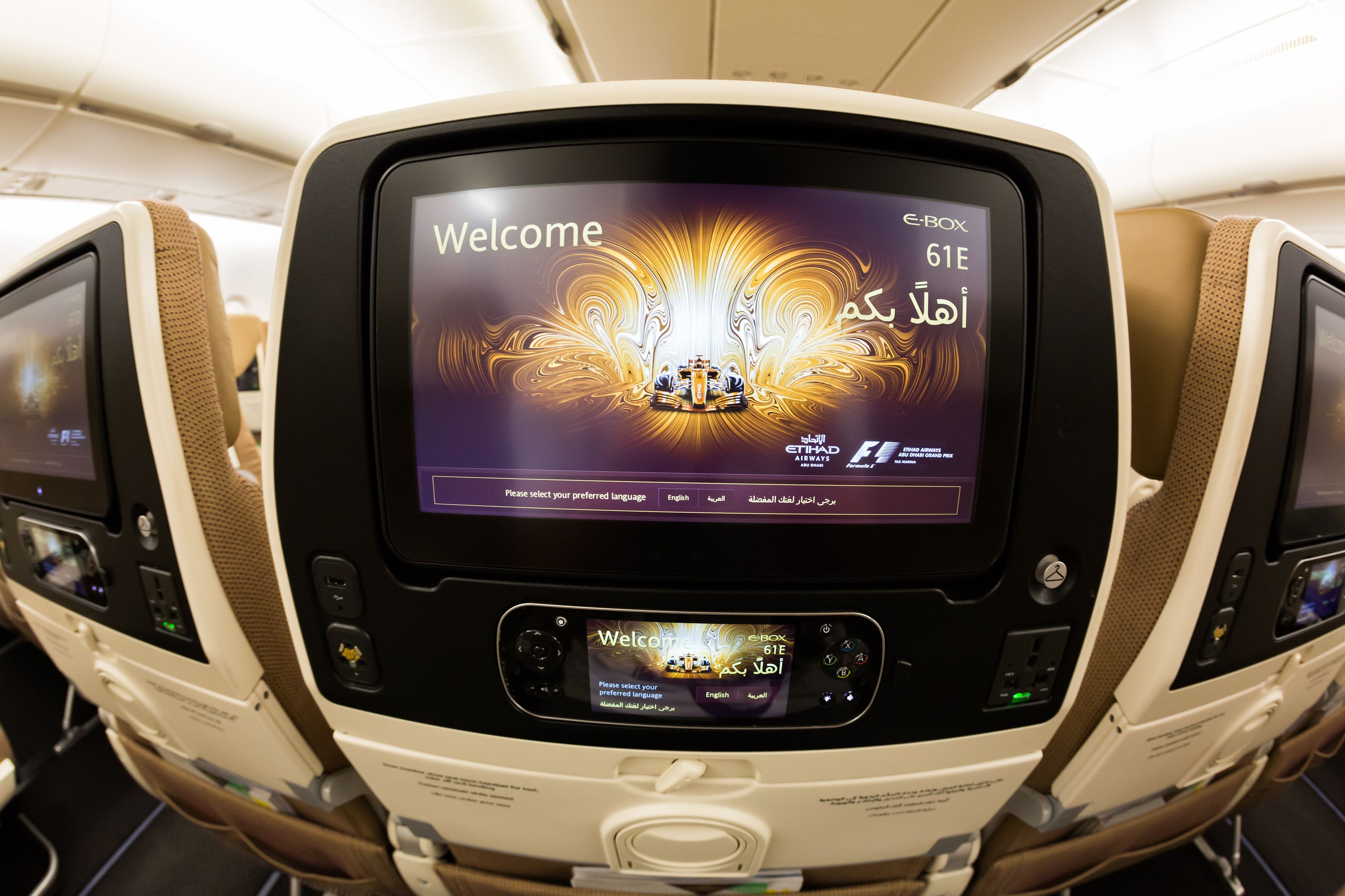 A closeup of the IFE screen on an Etihad economy class seat.