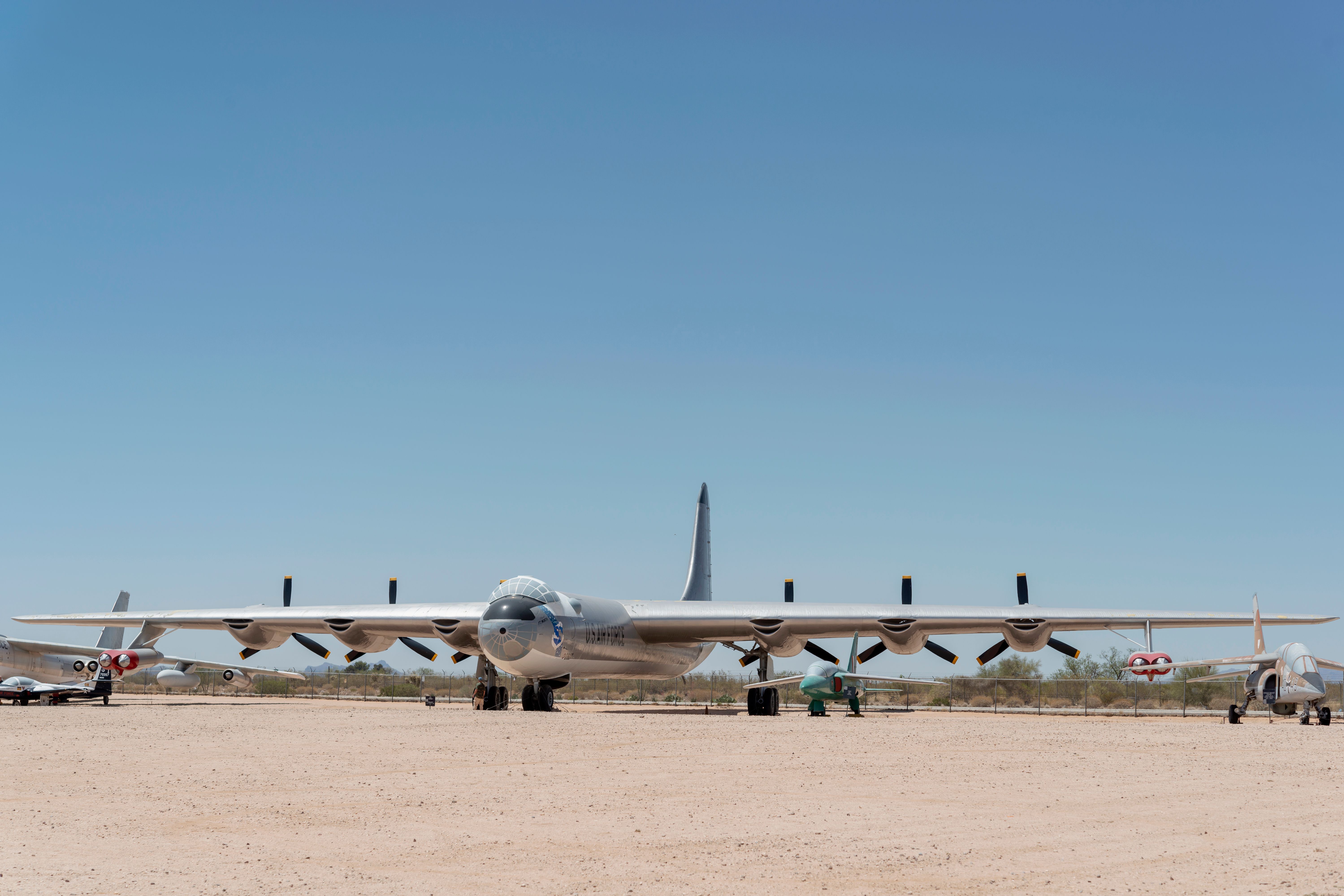 A Convair B-36 Peacemaker parked in a desert.