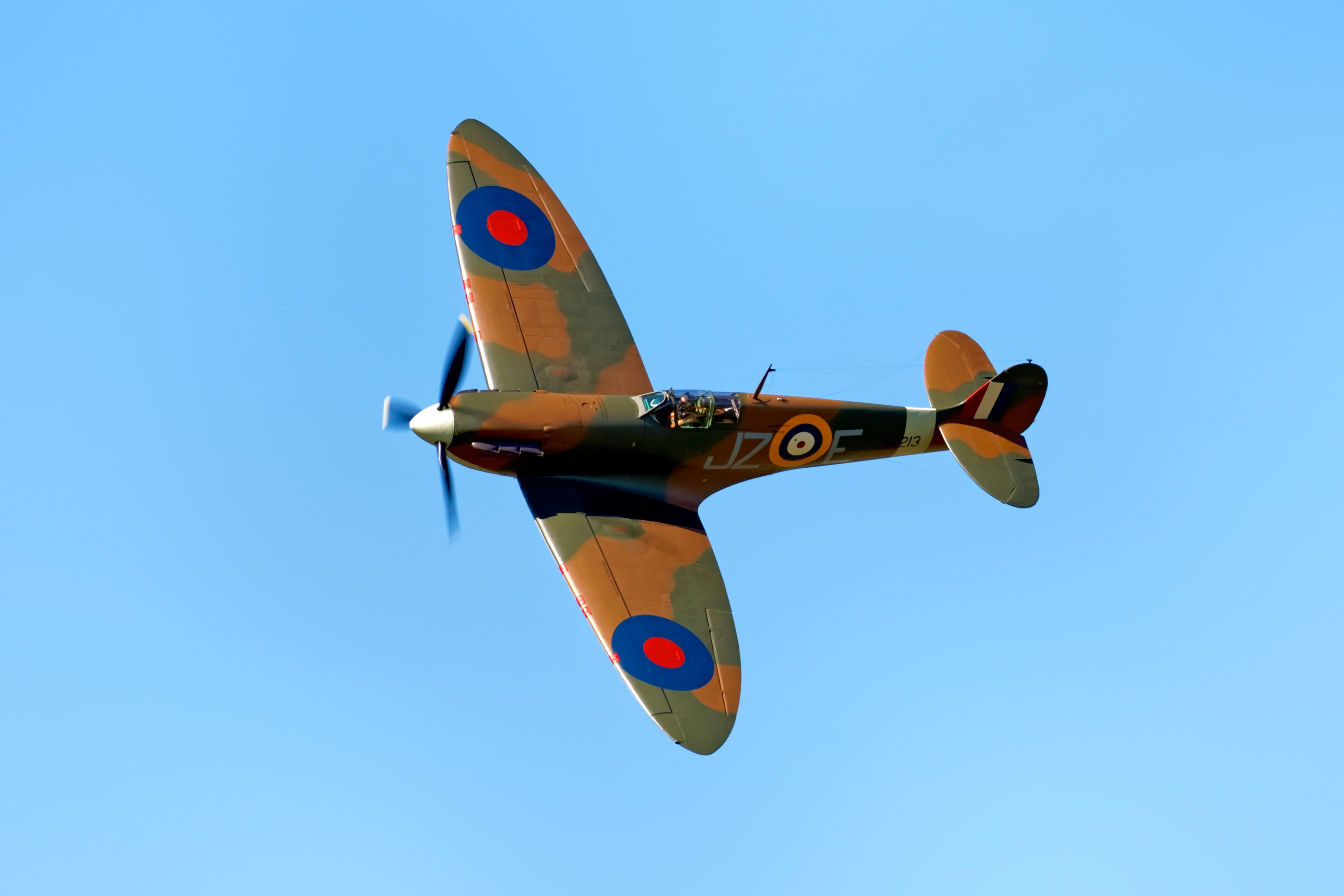 A Supermarine Spitfire flying in the sky.