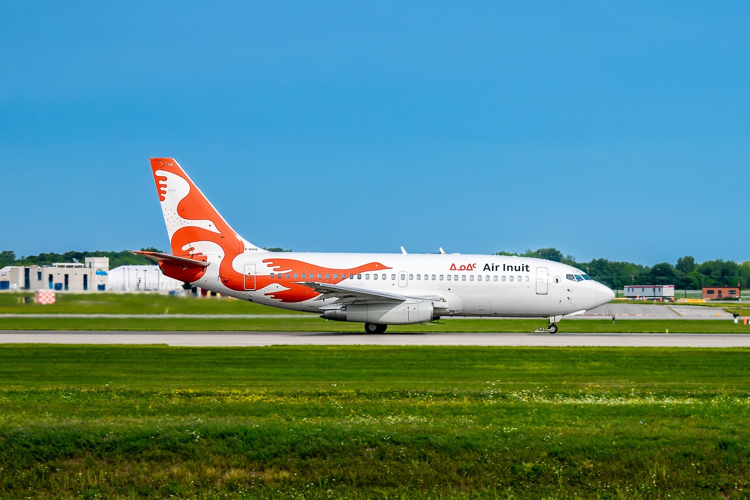 An Air Inuit Boeing 737-200C on a runway.