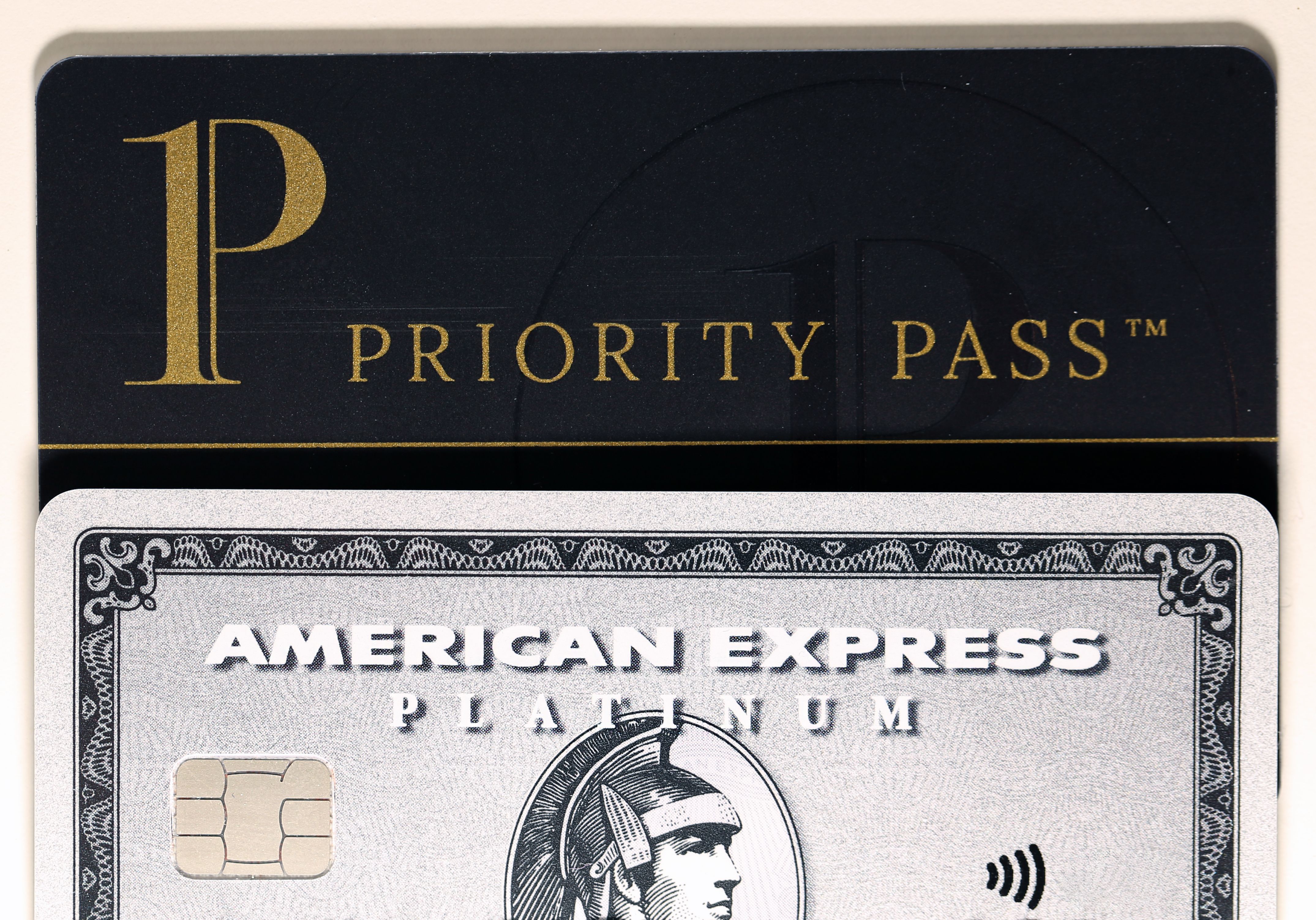 An American Express Platinum Card underneath the words Priority Pass.