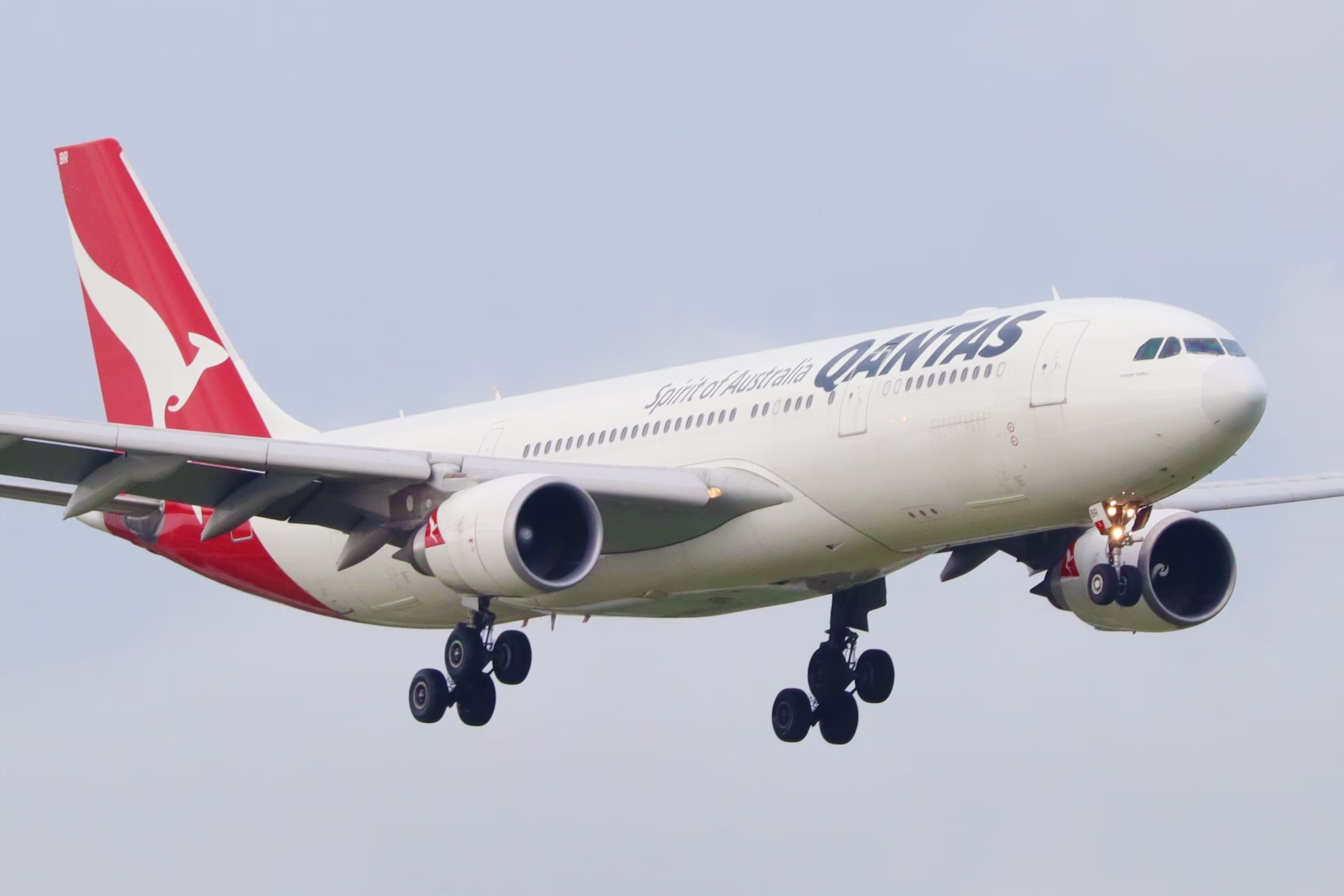 A Qantas Airbus A330 flying in the sky.