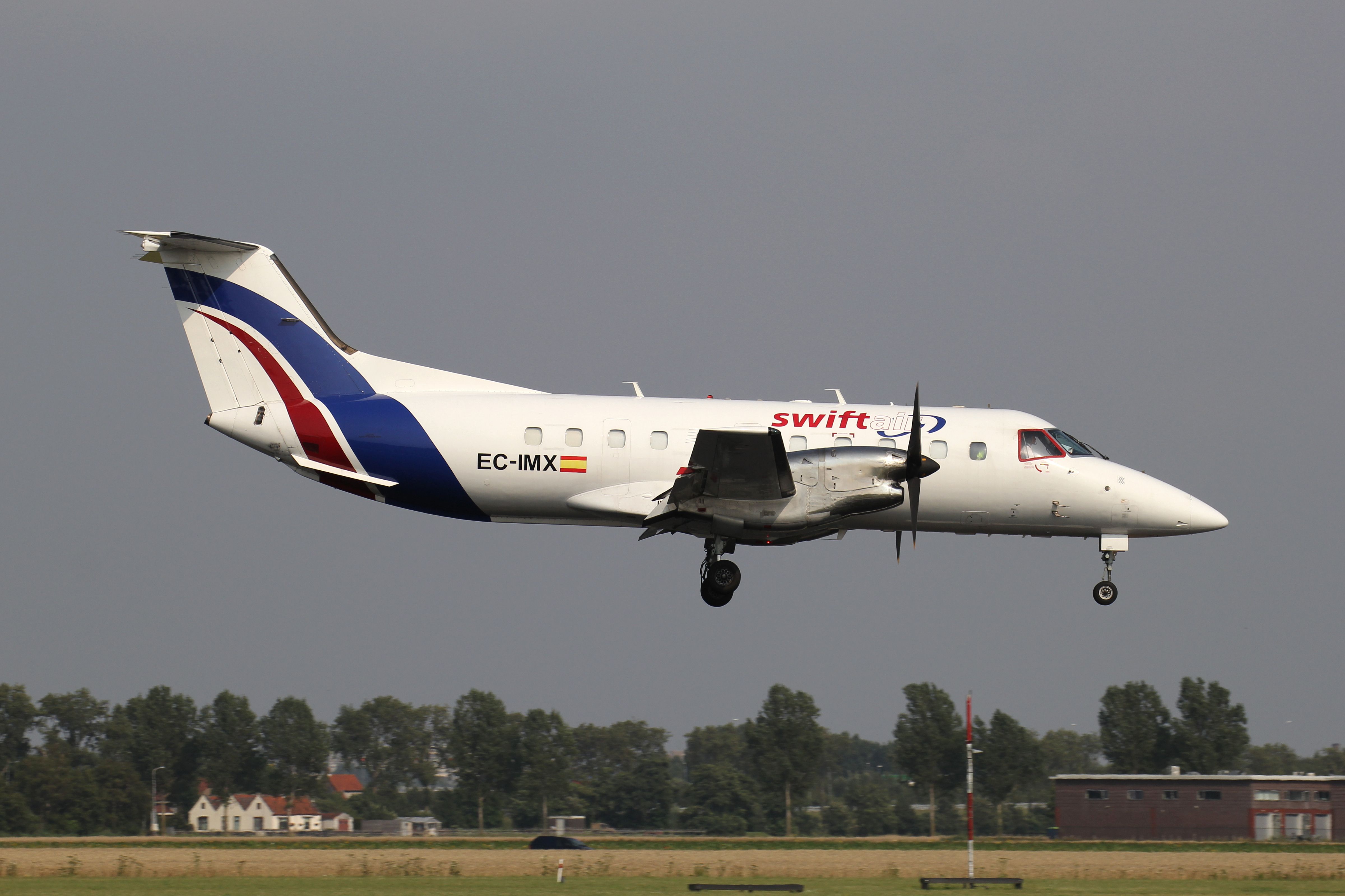 A Spanish Swiftair Embraer EMB-120 Brasilia about to land.