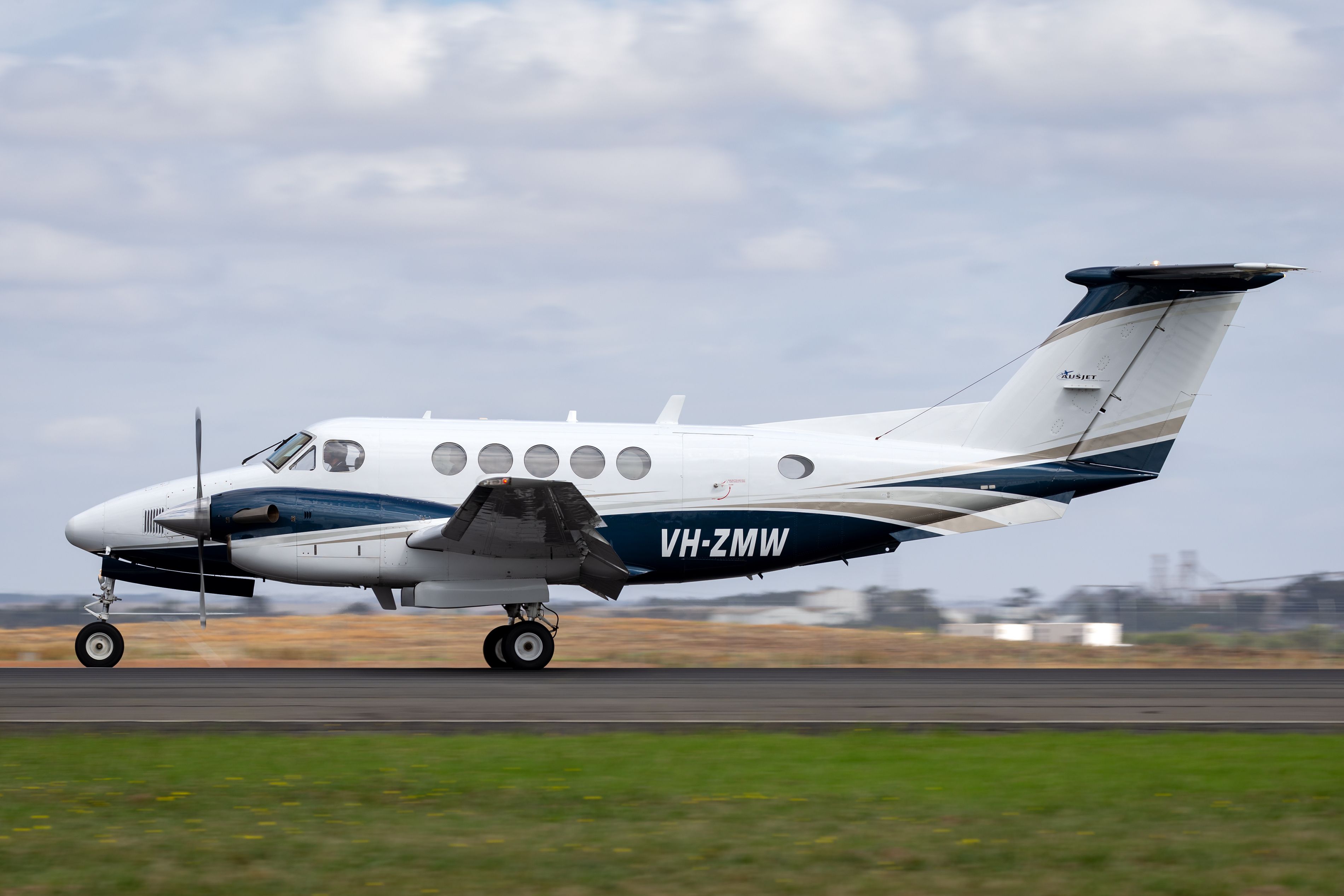 A Beechcraft King Air about to take off.