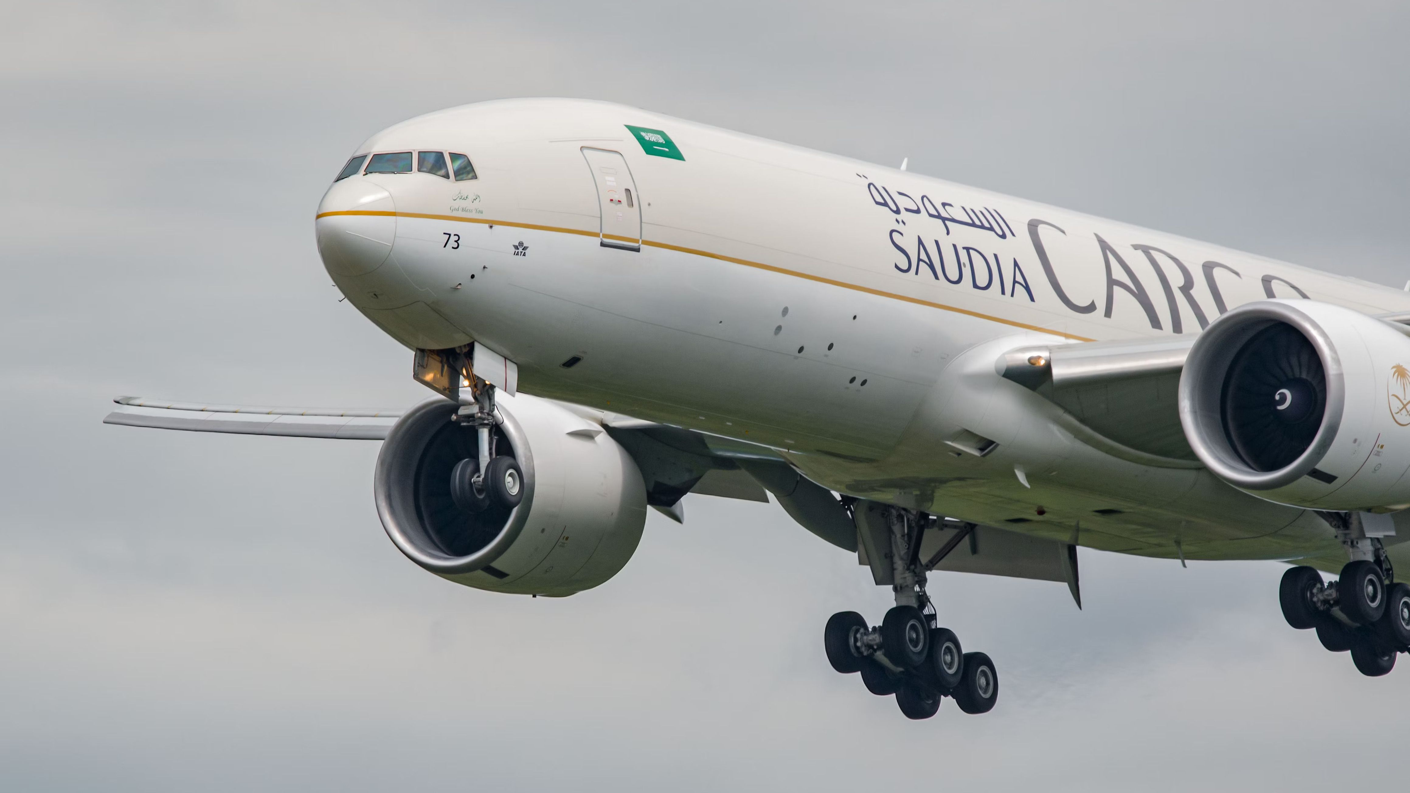 A Boeing 777F of Saudia Cargo flies in the sky.