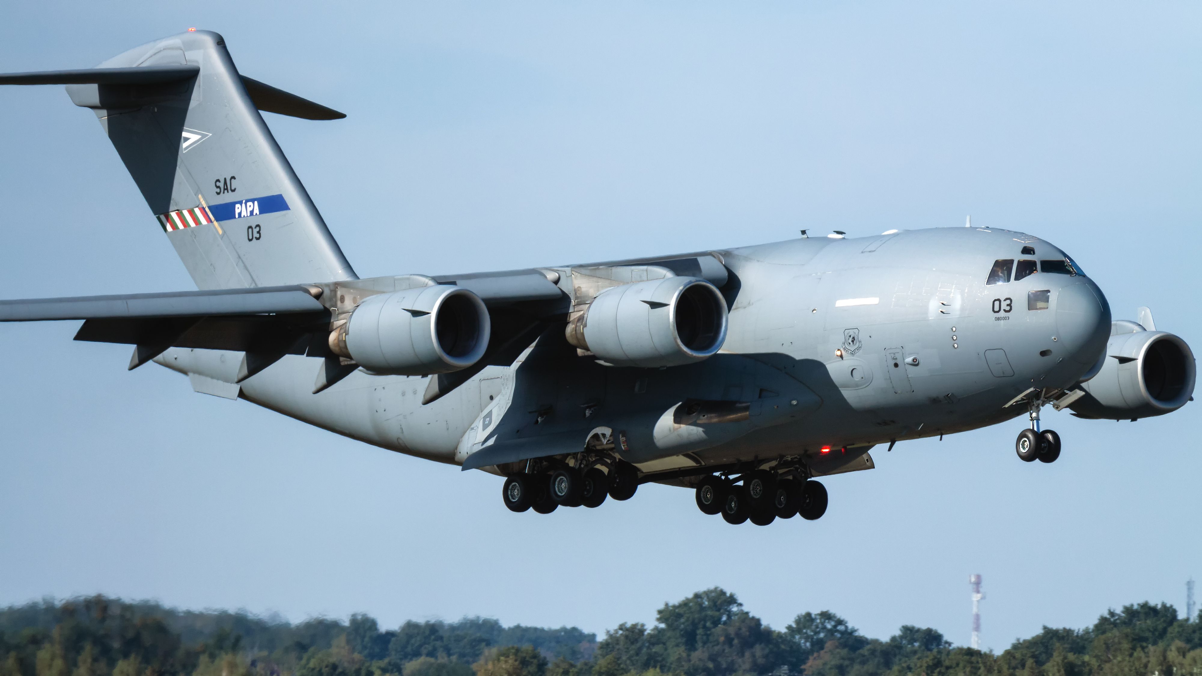 A Boeing C-17 Globemaster III Flying Close To The Ground.