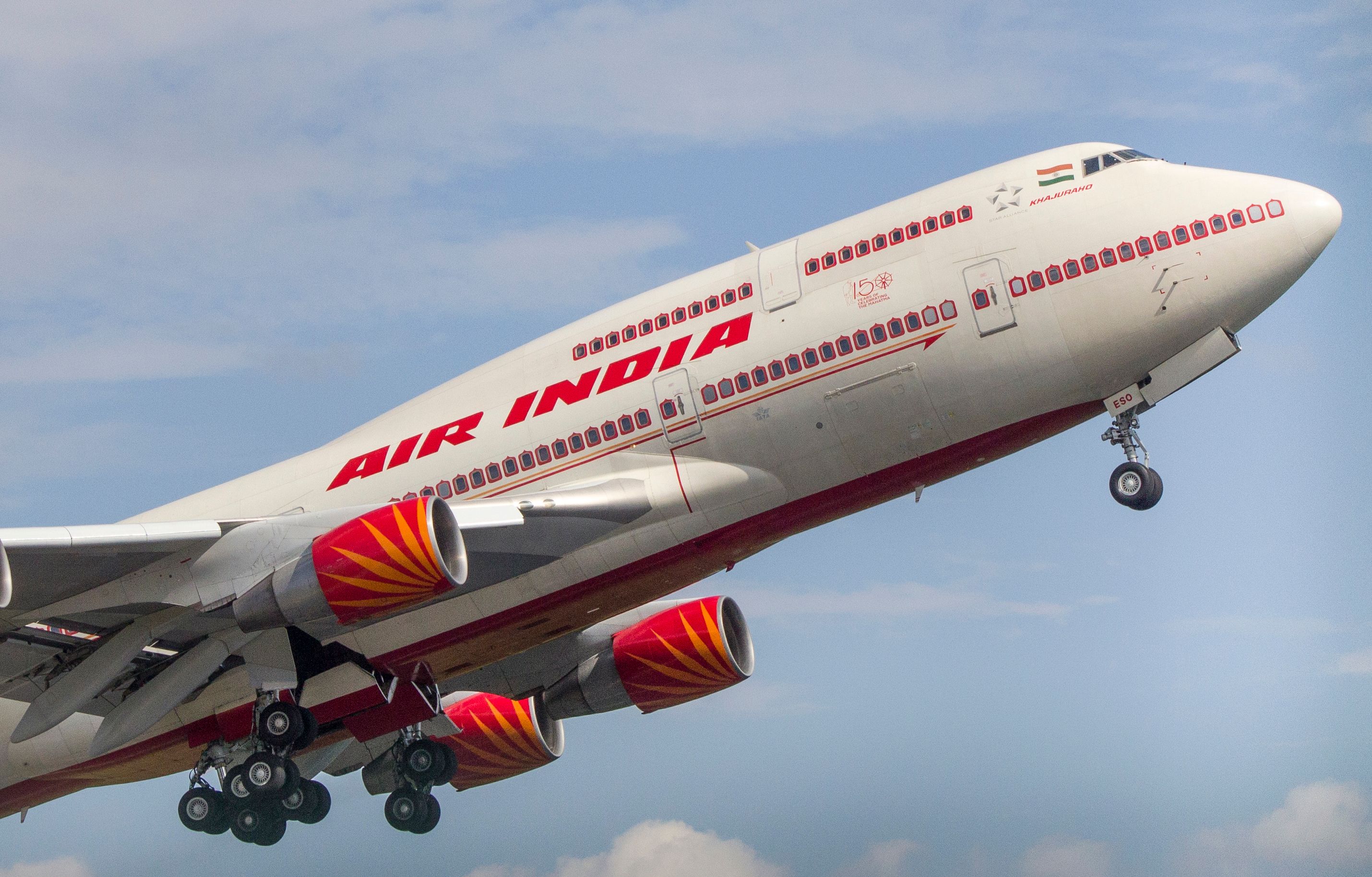 An Air India Boeing 747 flying in the sky.