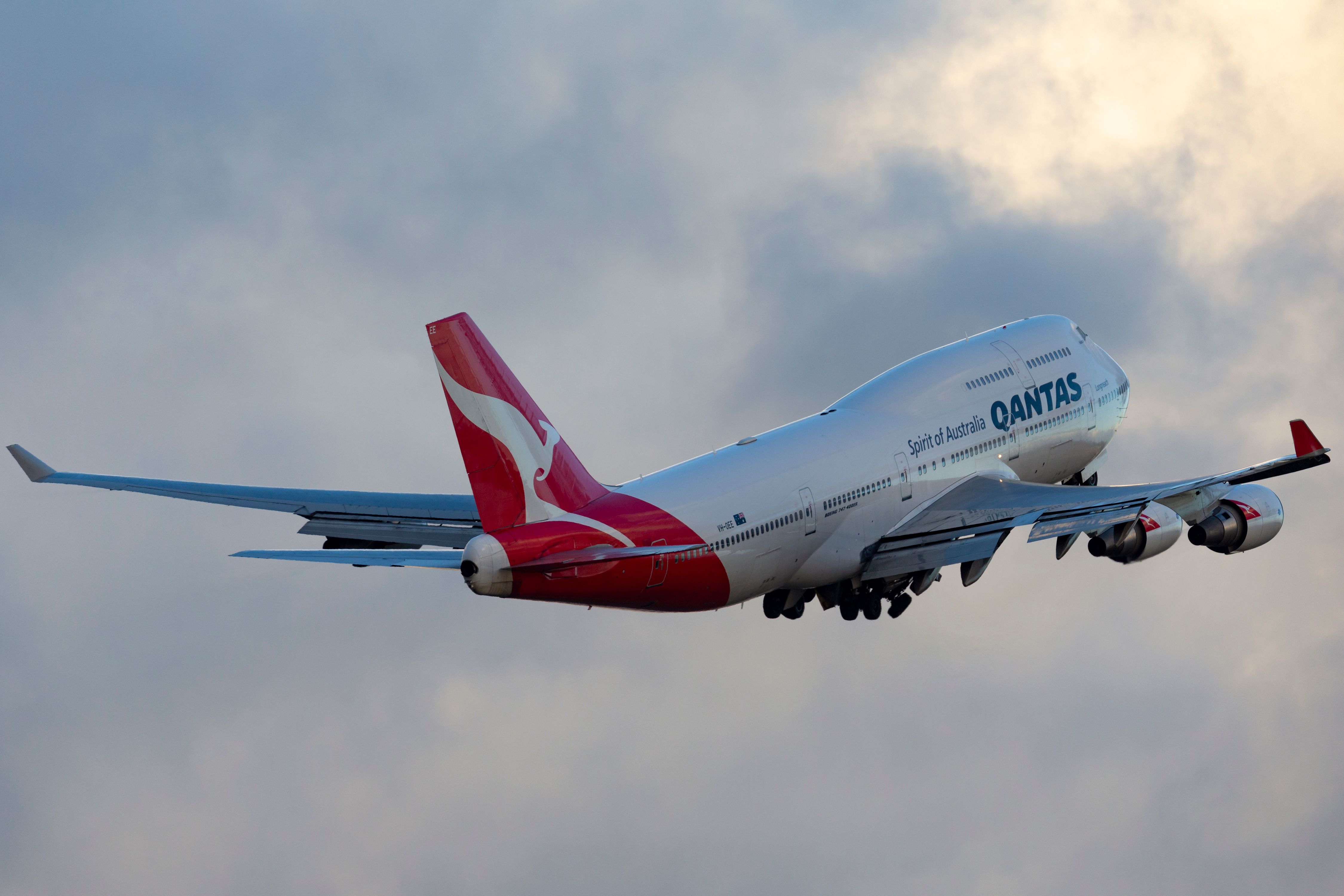 A Qantas Boeing 747 flying in the sky.