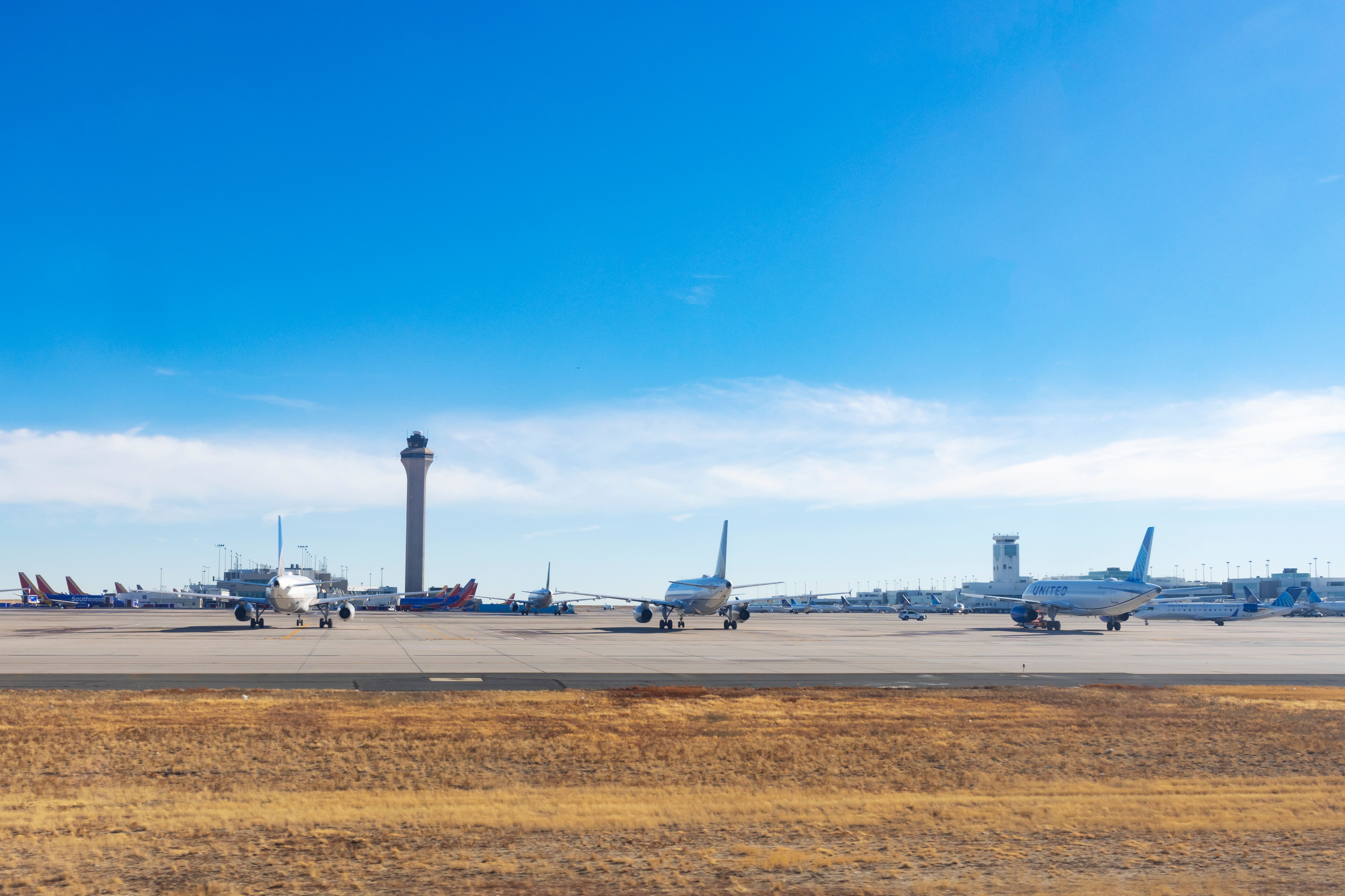 Multiple United & Southwest Planes Parked At Denver International Airport.