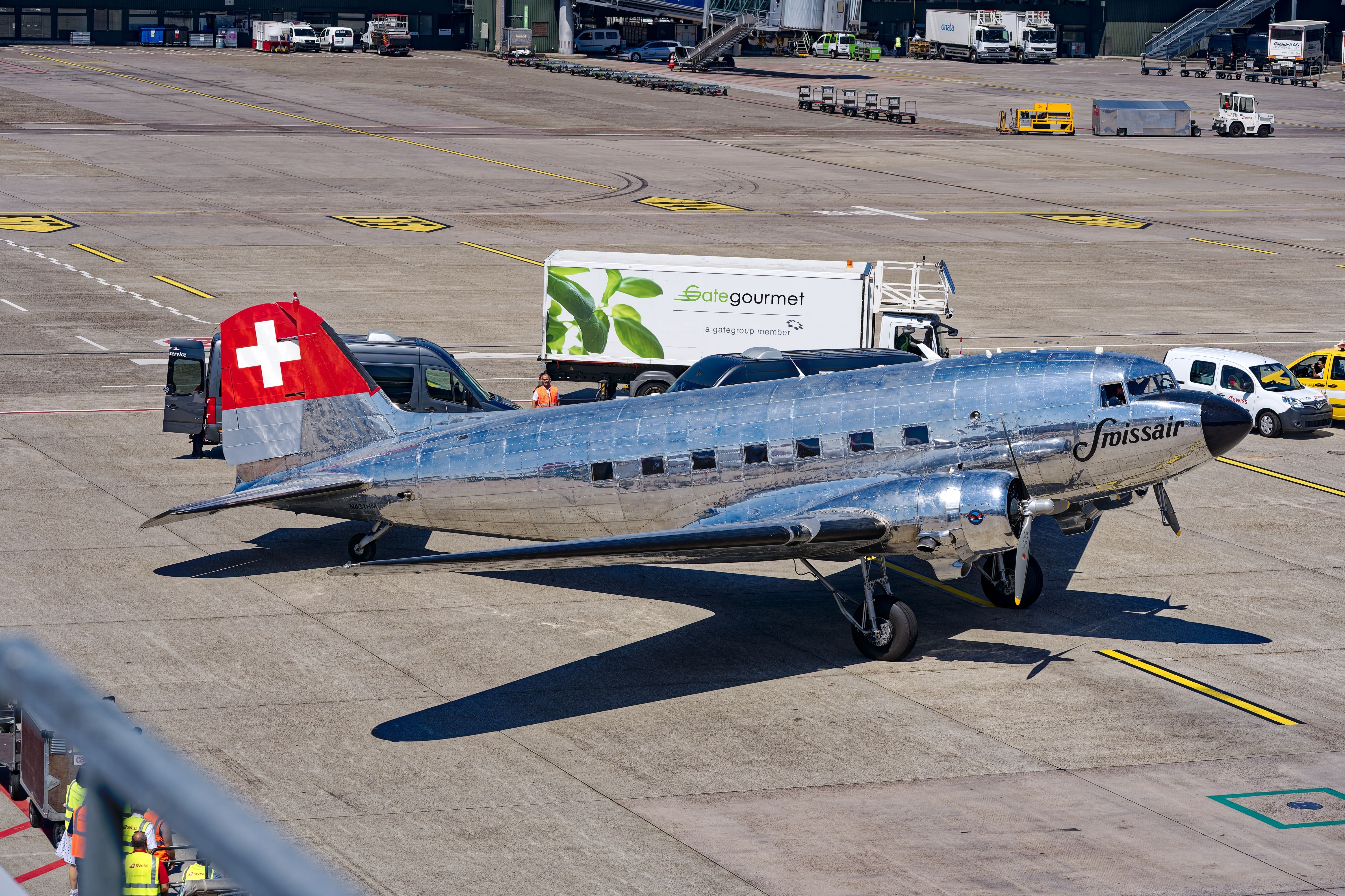 A SWISS Douglas DC-3 on an airport apron.