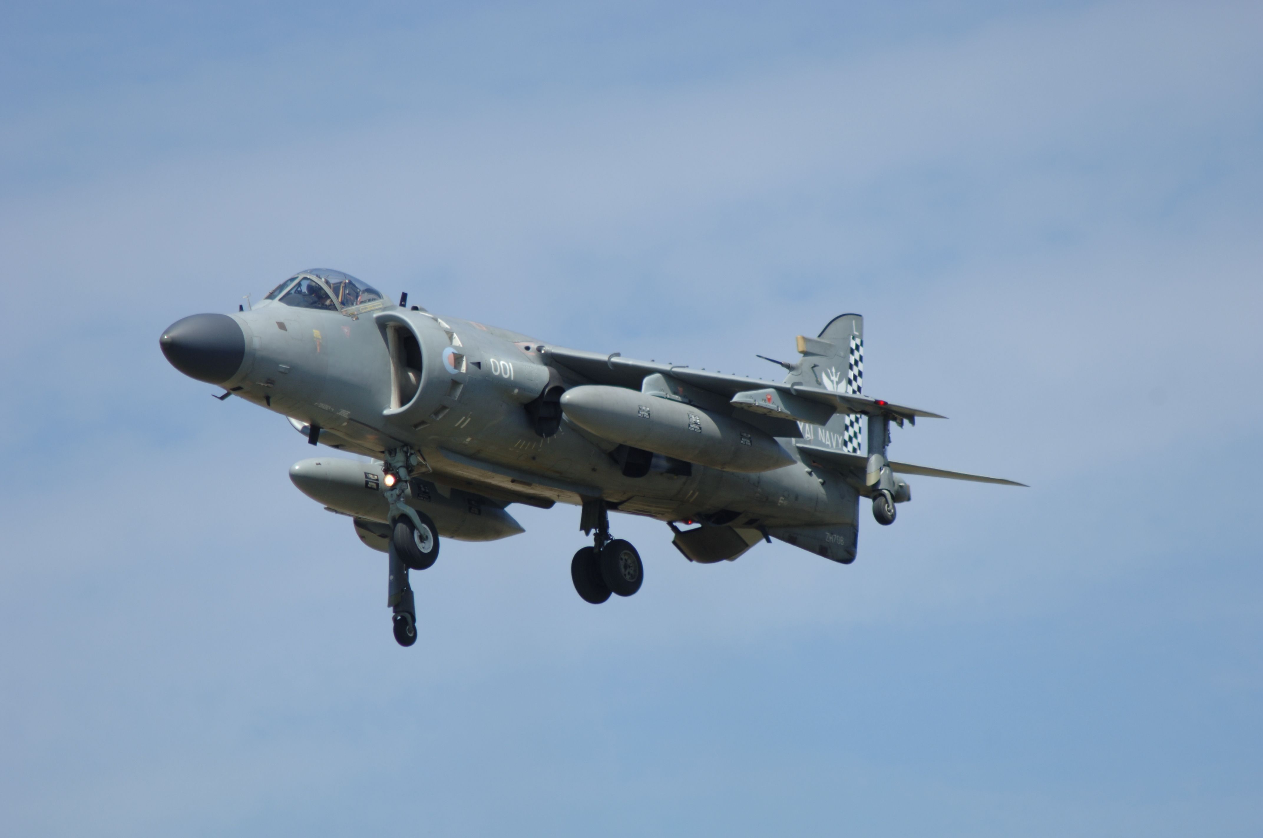 A Royal Navy FA2 Sea Harrier Jump jet flying in the sky.