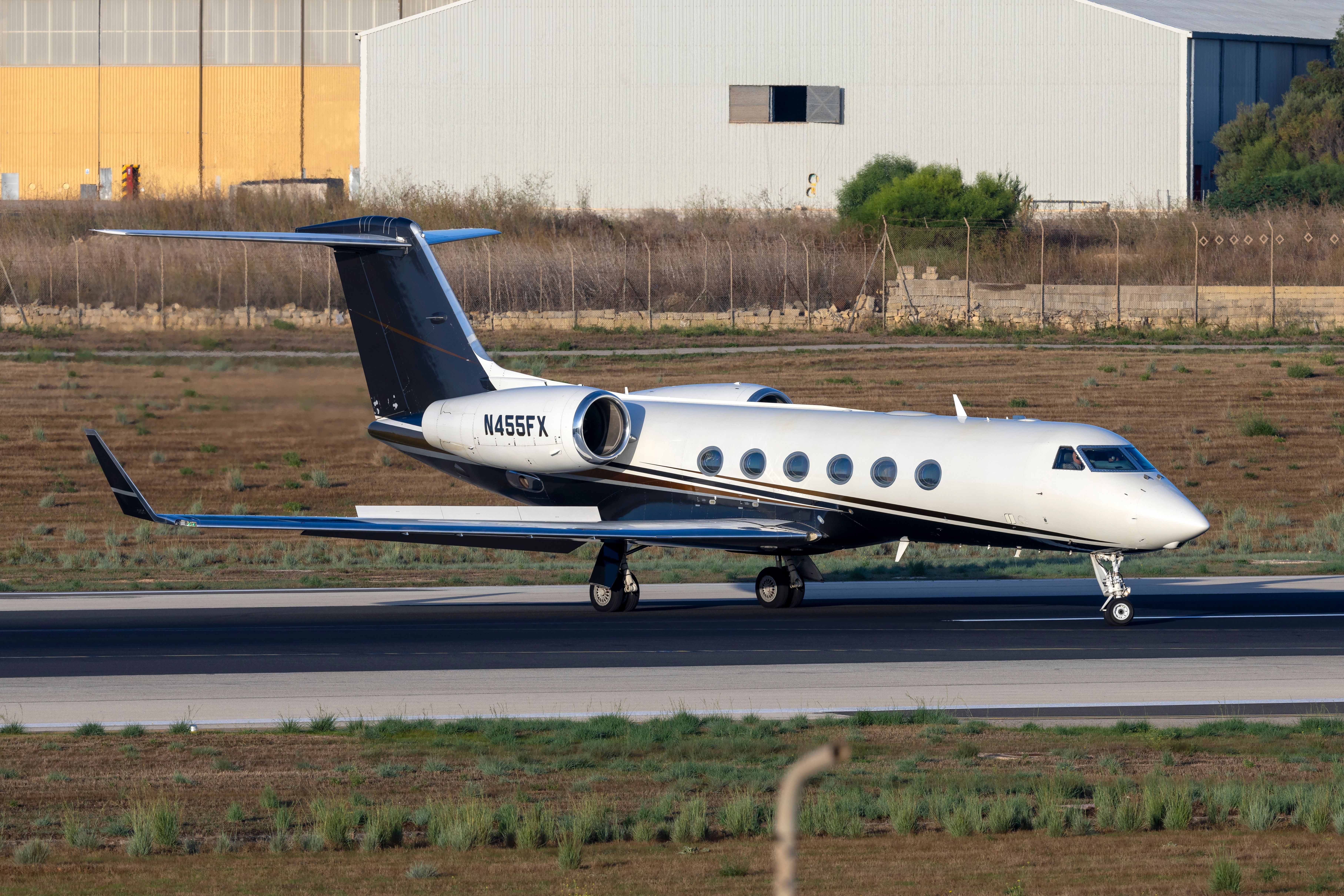 A Gulfstream G450 on an airport apron.