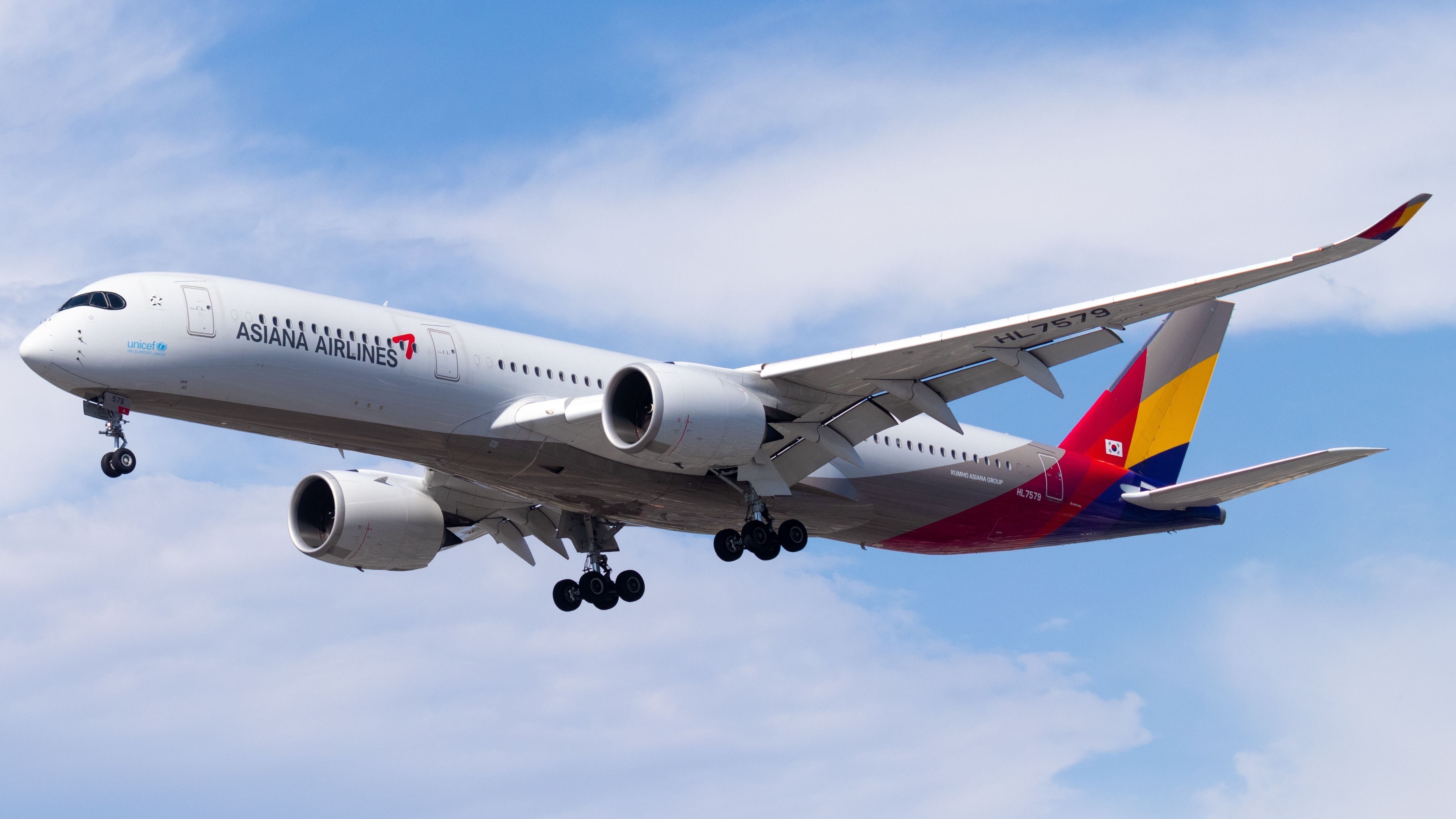 An Asiana Airlines Airbus A350 flying in the sky.