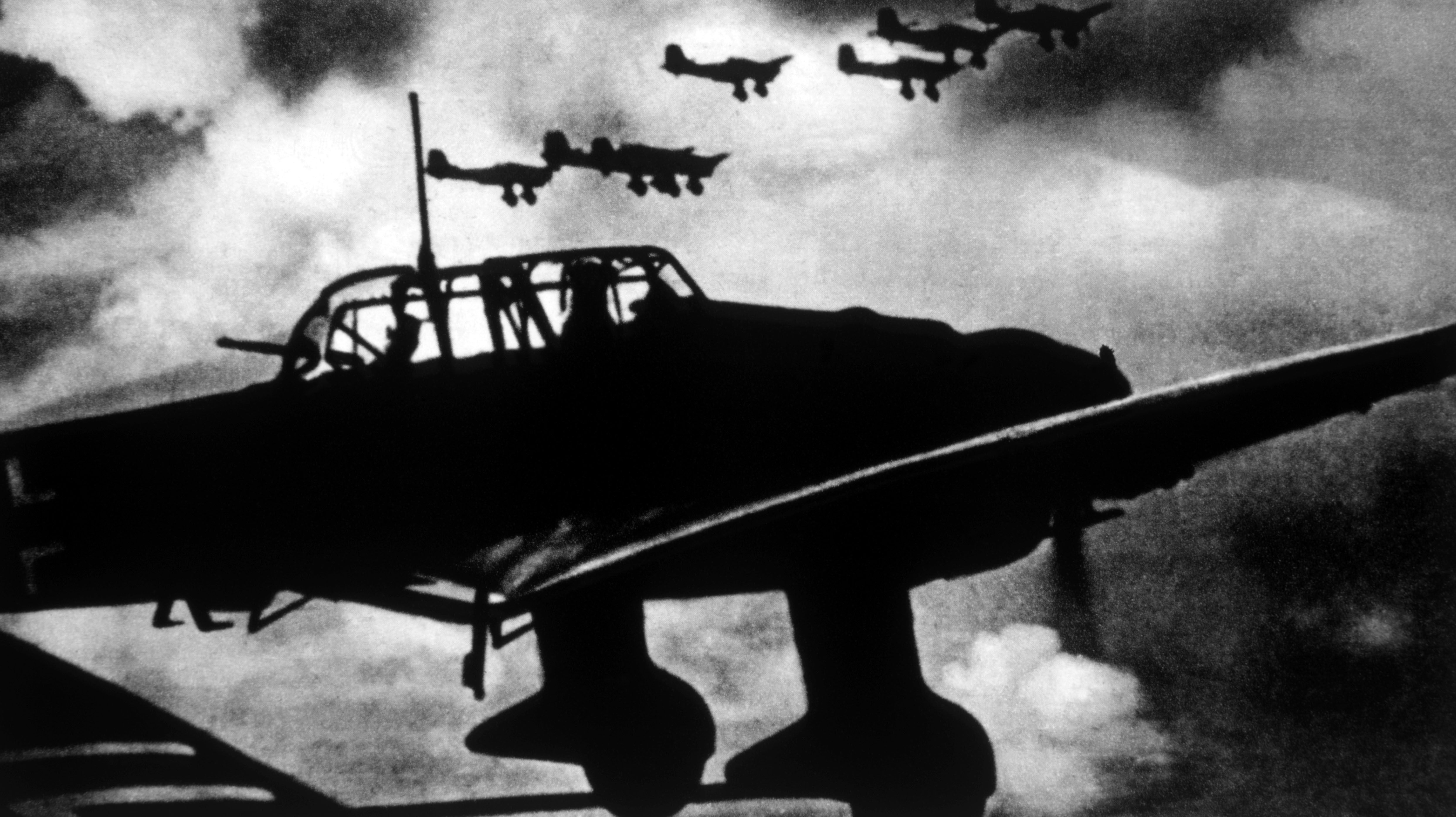 A black and white photo of many Junkers Ju-87 Stuka aircraft.