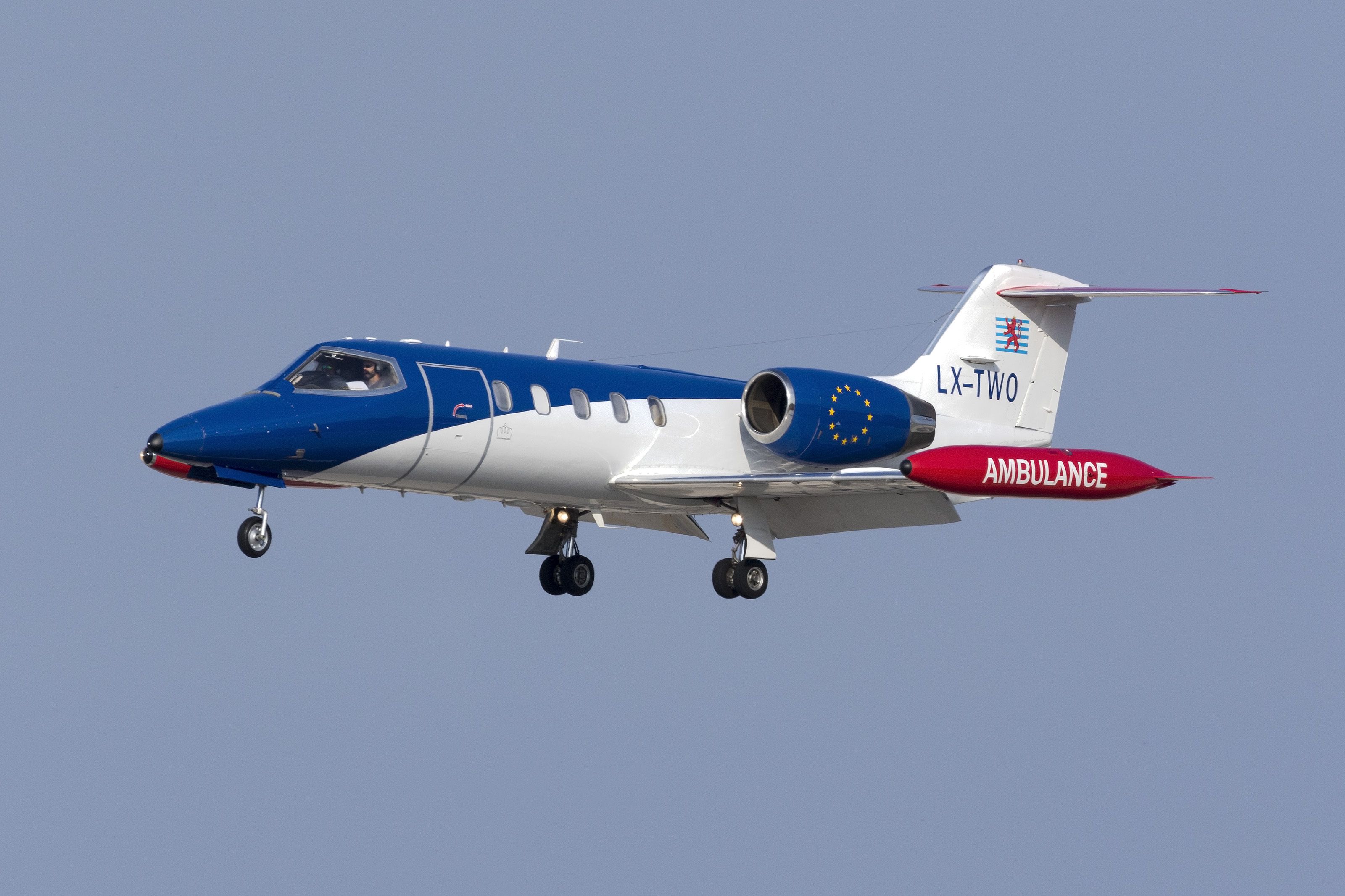 A Luxembourg Air Ambulance Learjet 35A/ZR flying in the sky.