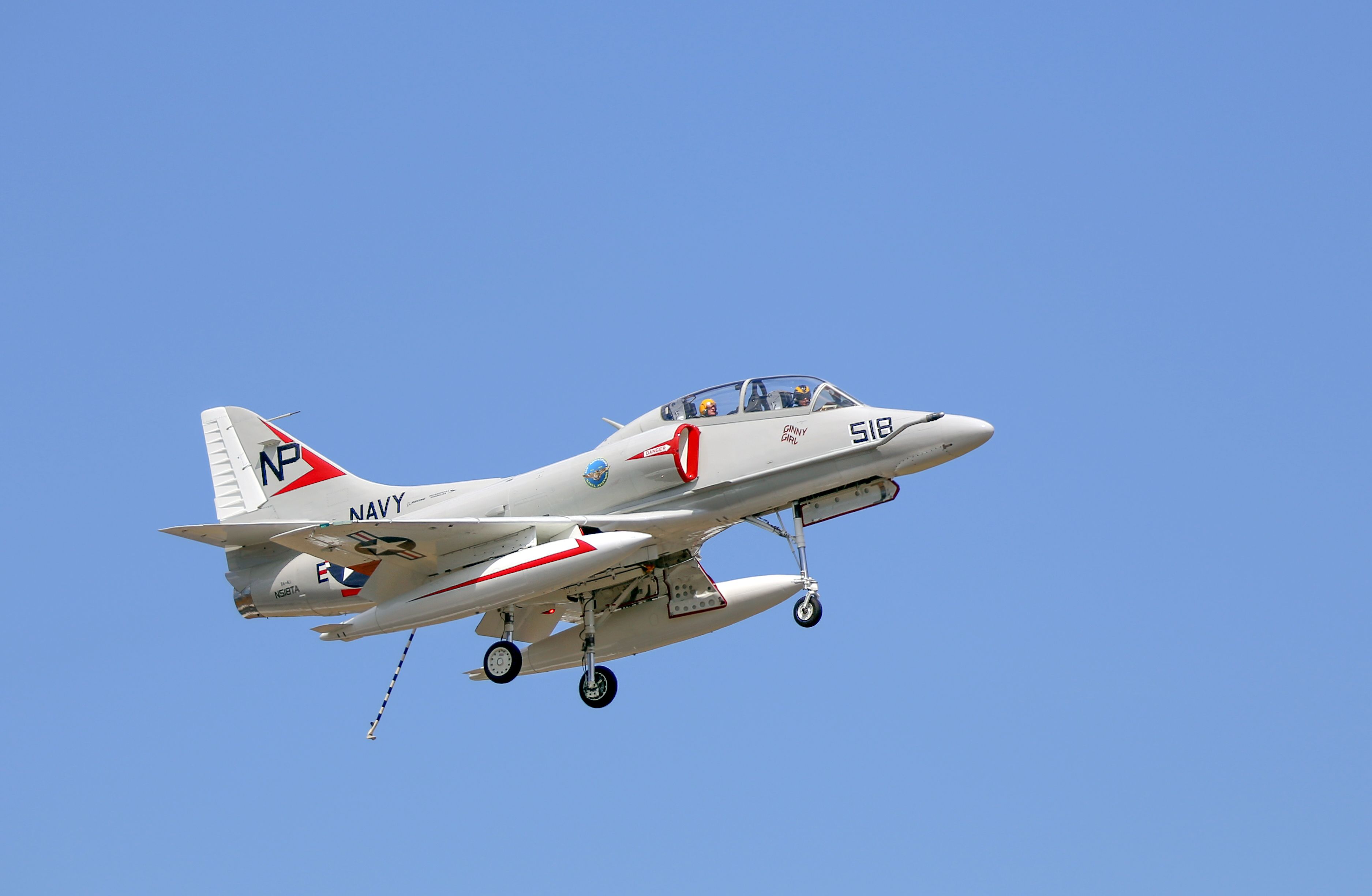 A US Navy TA-4J Skyhawk flying in the sky.