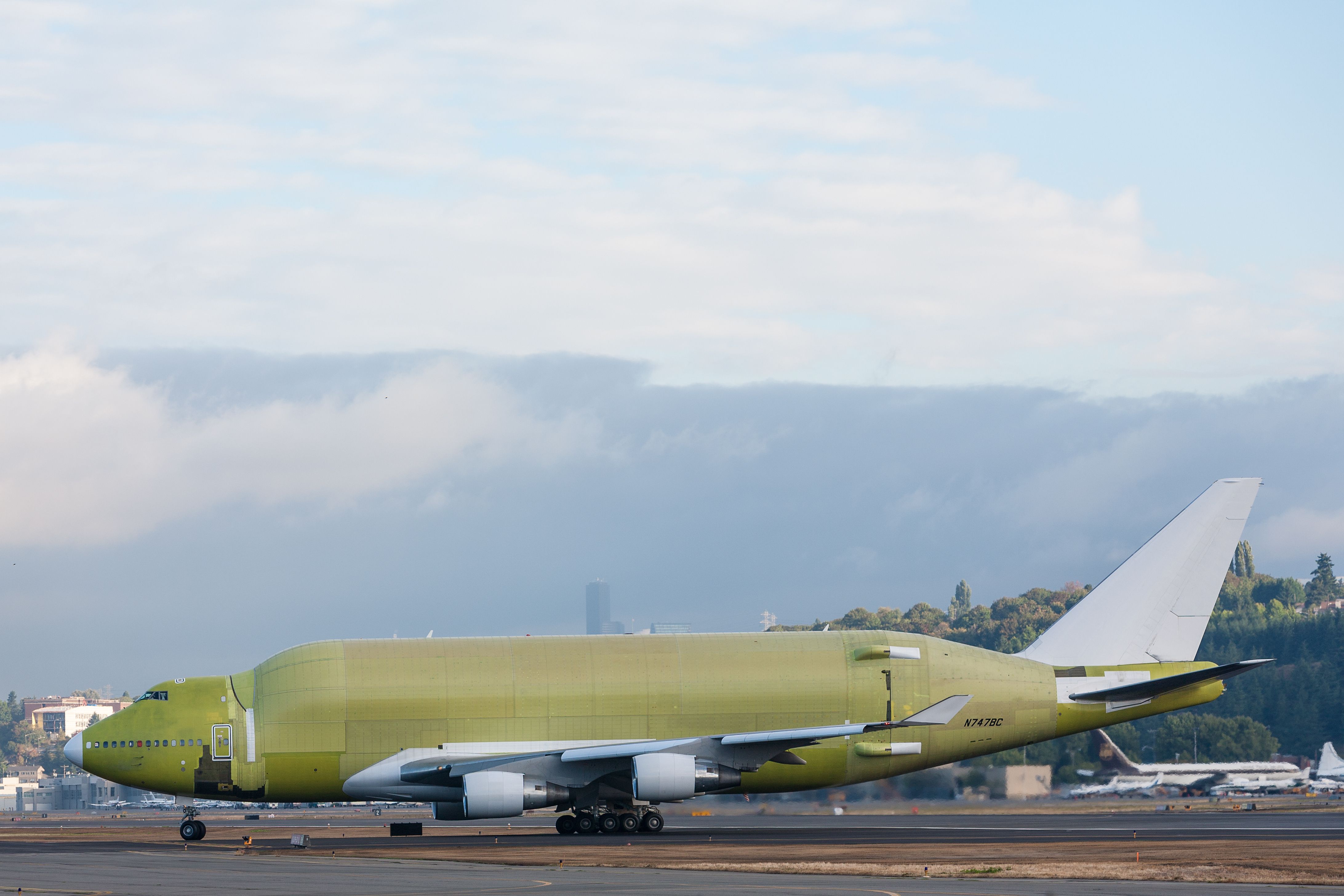 An unpainted Boeing Dreamlifter on an airport apron.