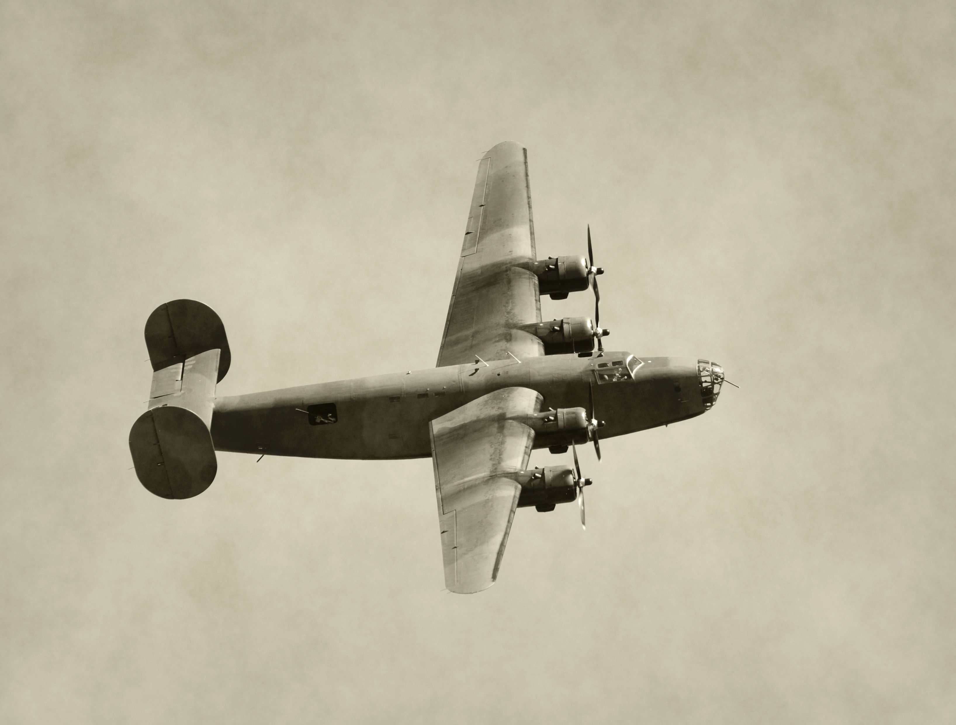 A B-24 flying in the sky.