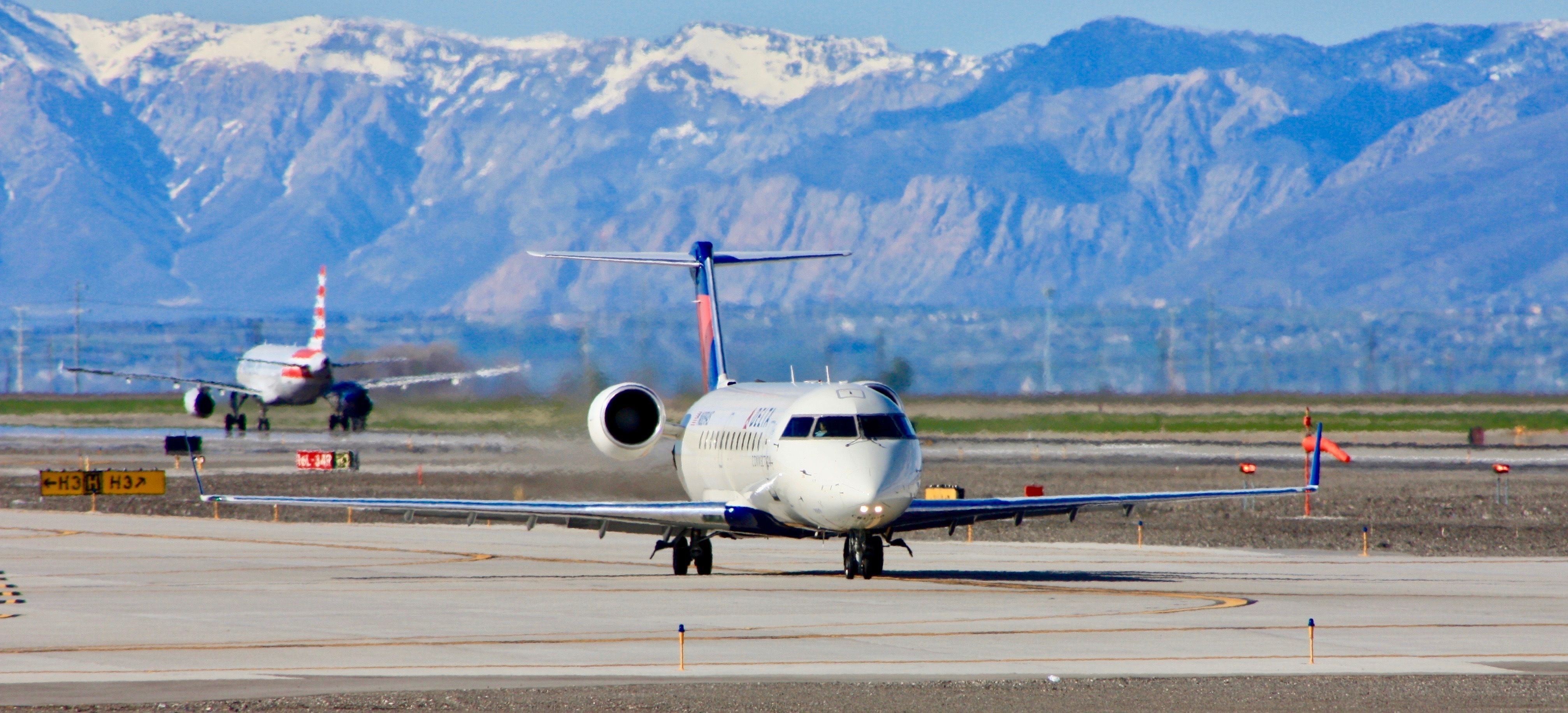 Bombardier CRJ-200 taxies to the runway for departure at Salt Lake City International Airport