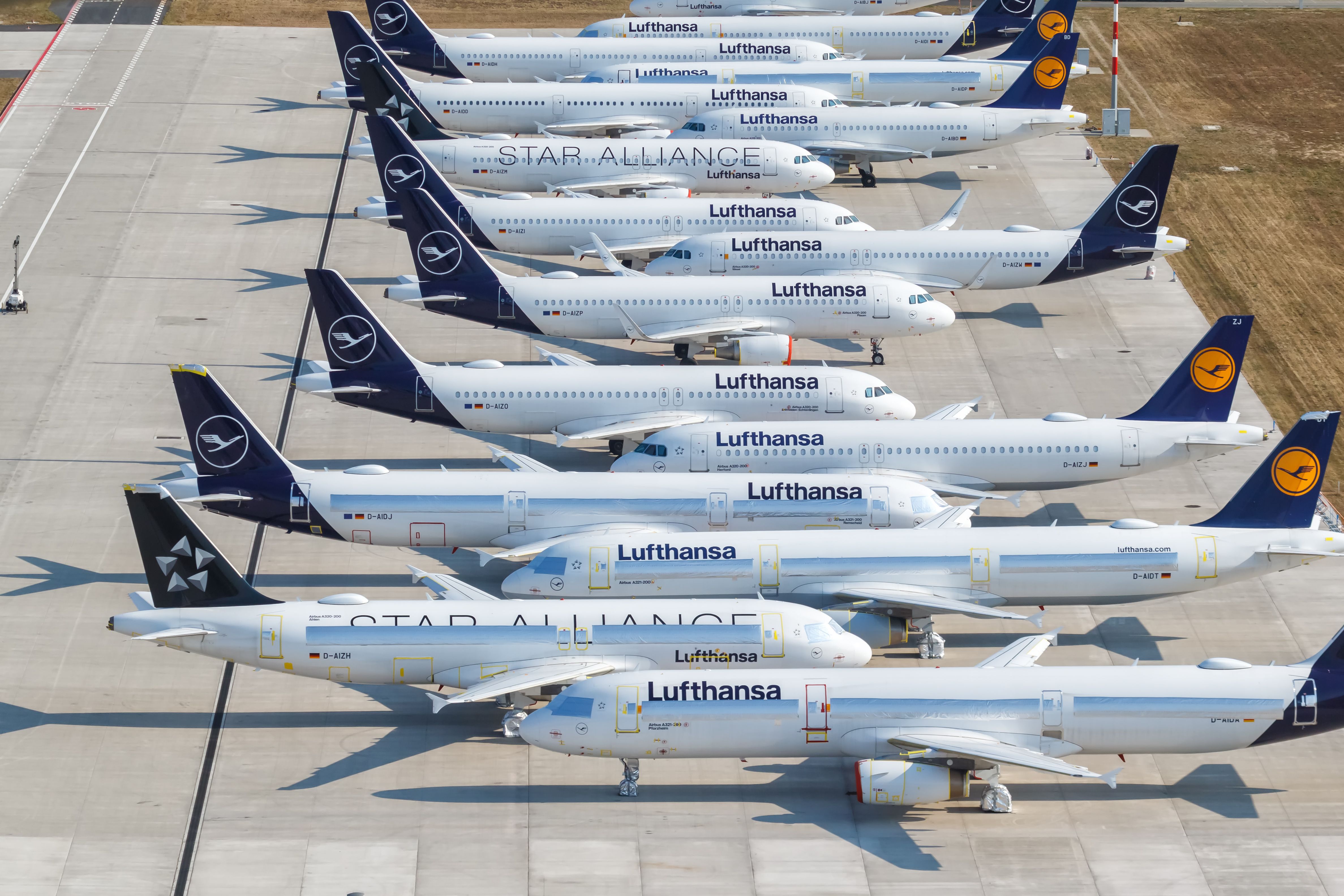 Several stored Lufthansa aircraft on the apron at Berlin Brandenburg Airport.