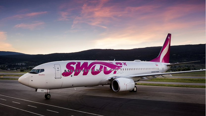 Swoop airlines plane sitting on the tarmac