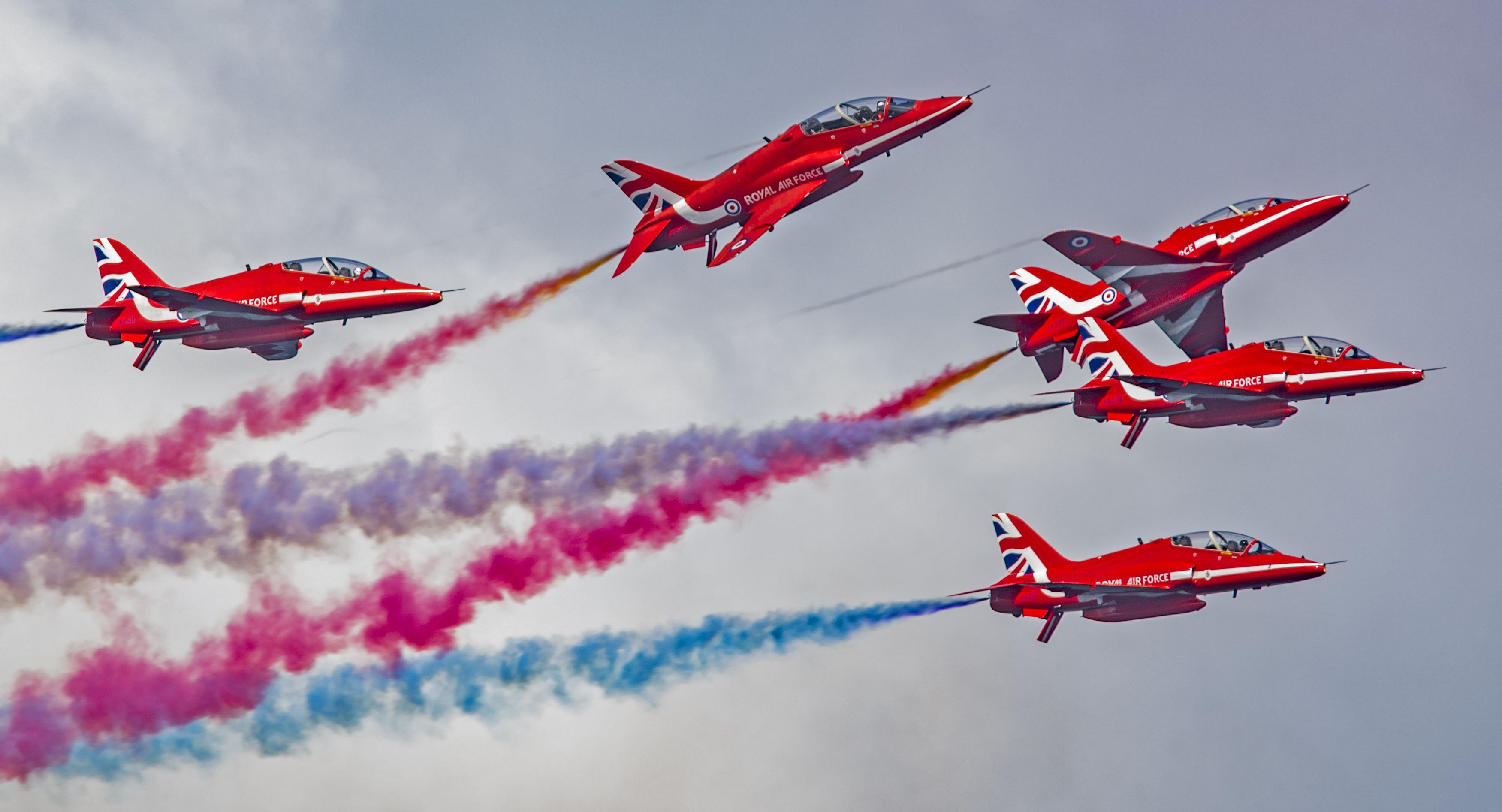 The RAF Red Arrows performing during an air show.