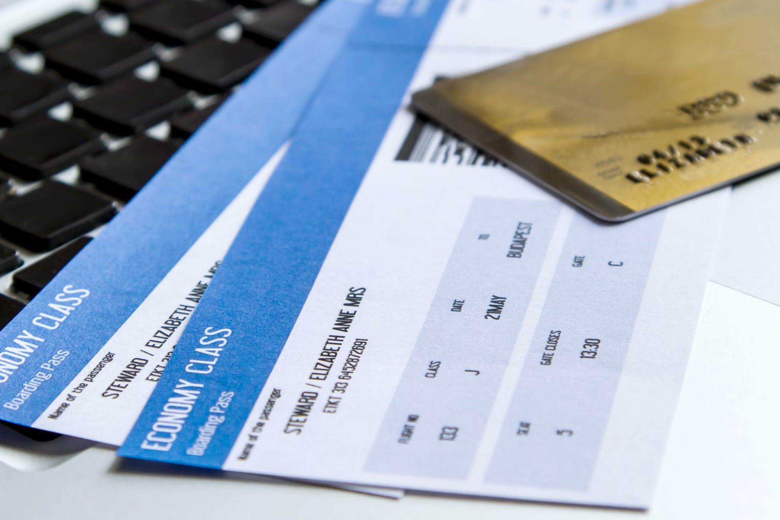 Credit CardA generic photo of two airline tickets underneath a gold credit card.