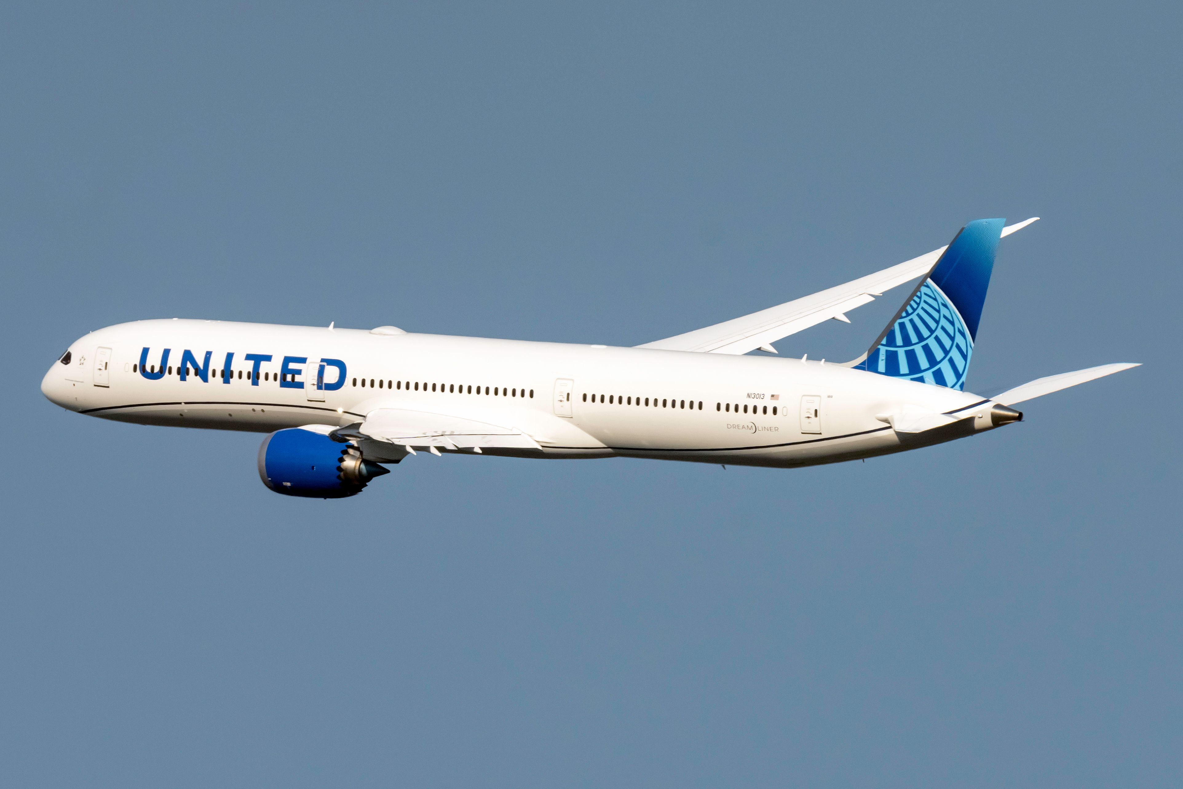 A United Airlines Boeing 787-10 Dreamliner Flying In The Sky.