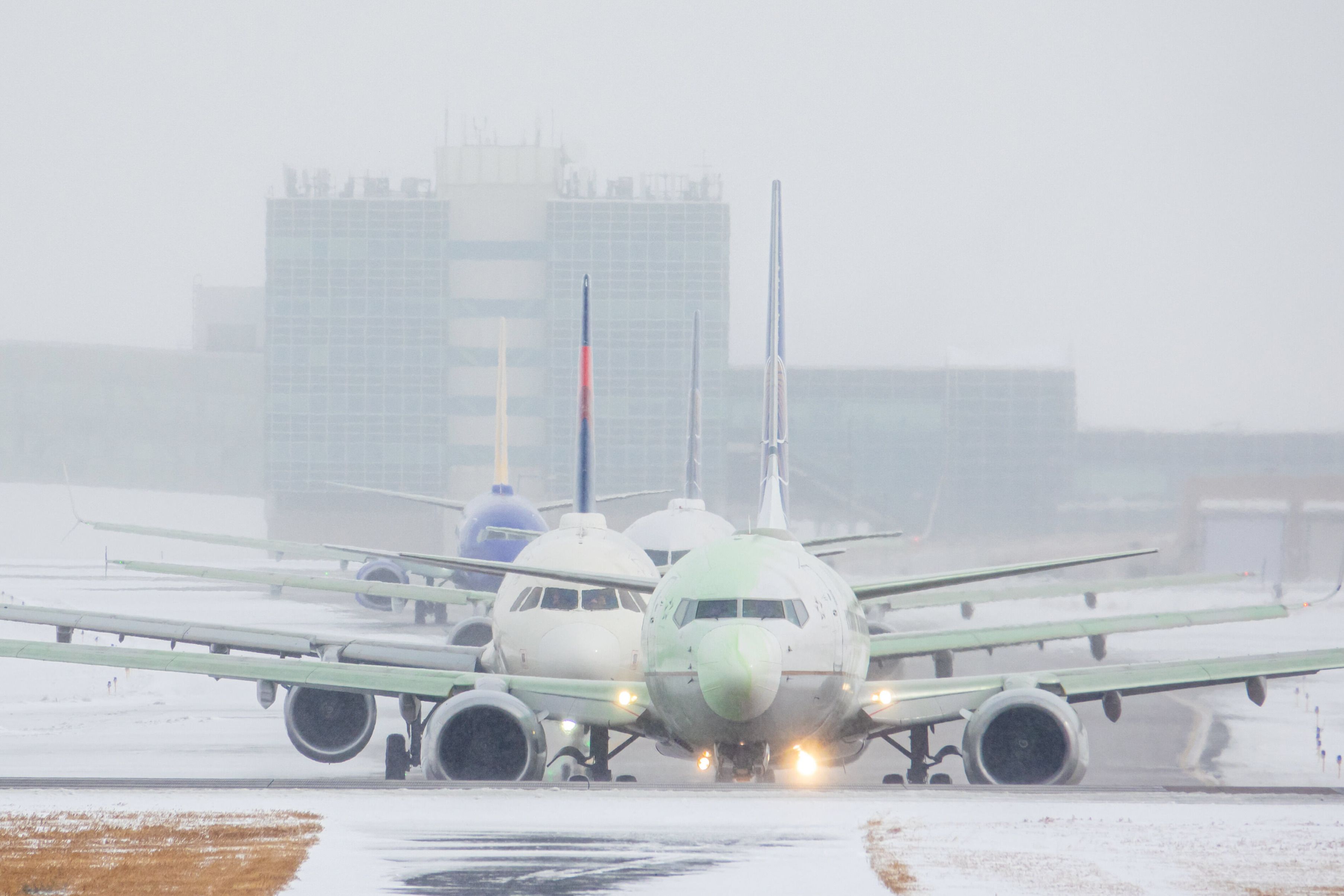 Planes departing in the snow