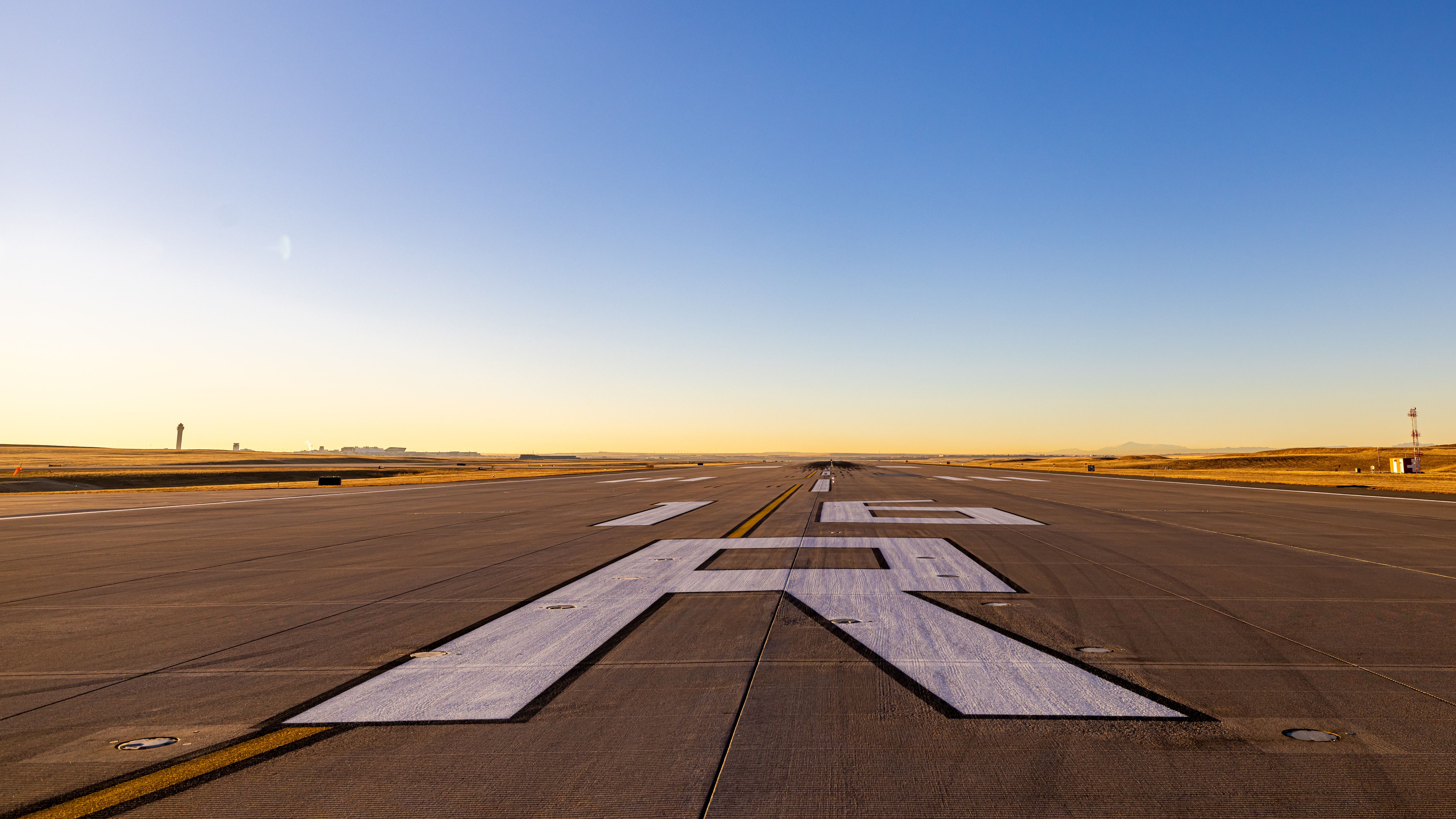 A closeup of Denver International Airport Runway 16R's markings.