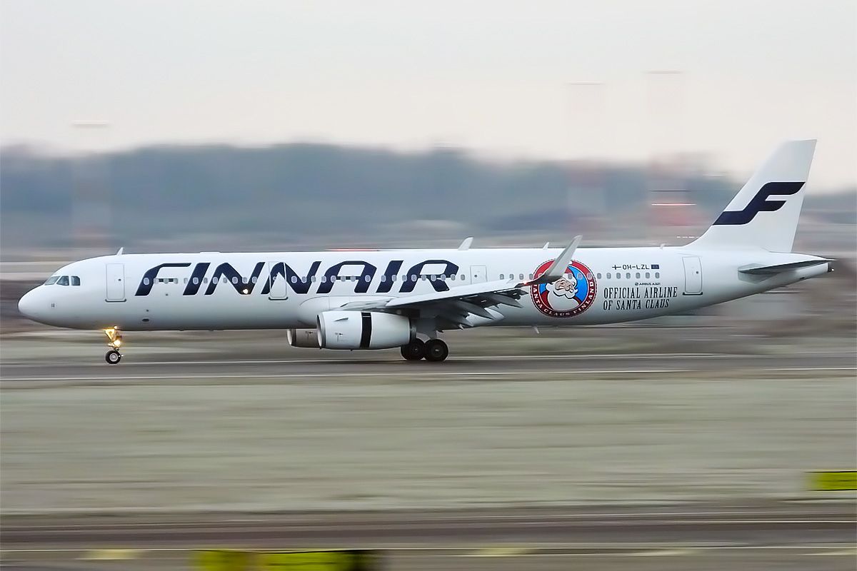 A Finnair Airbus A321 With Santa Livery On A Runway.