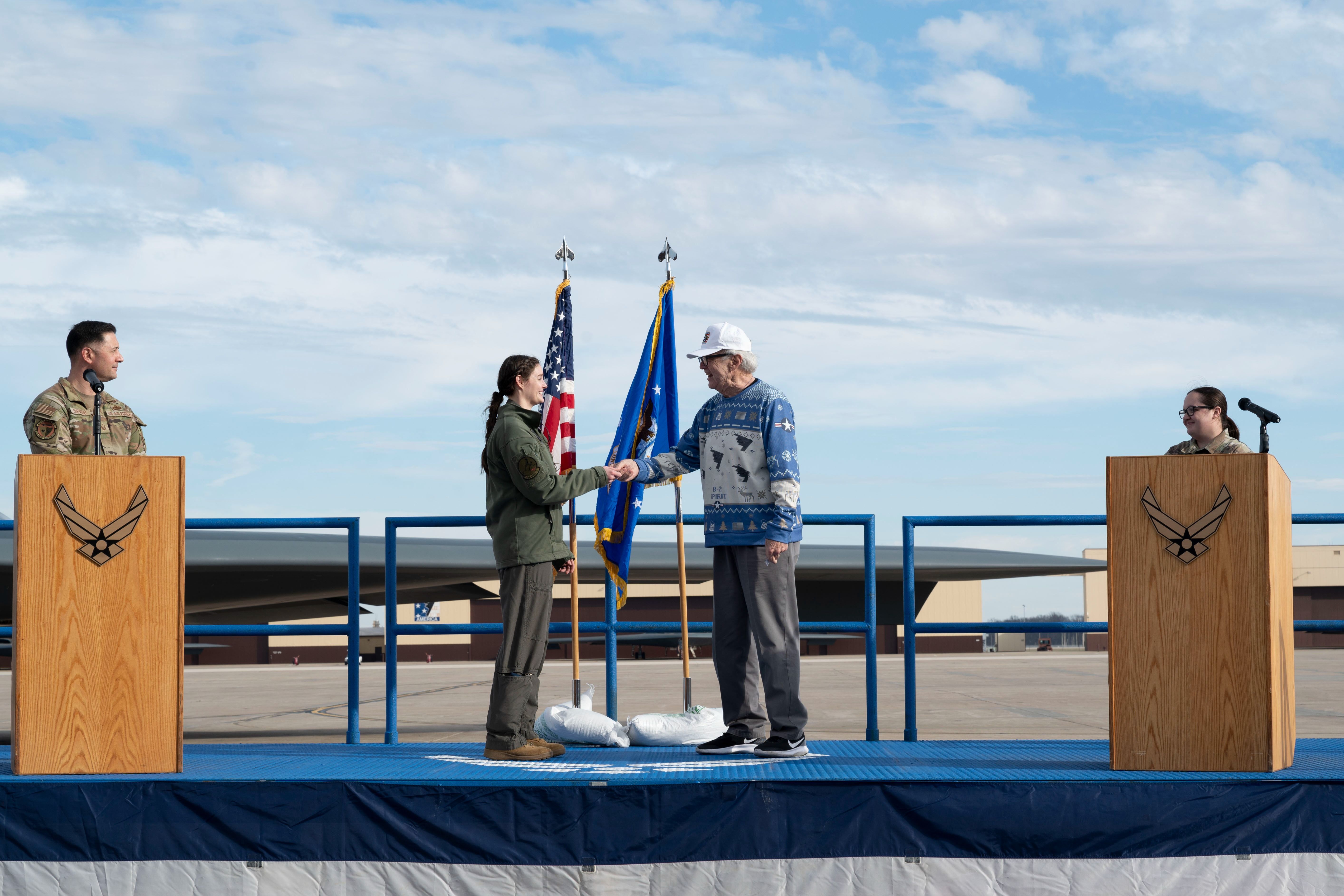 Two B-2 Spirit bomber pilots meet at the Whiteman AFB ceremony.