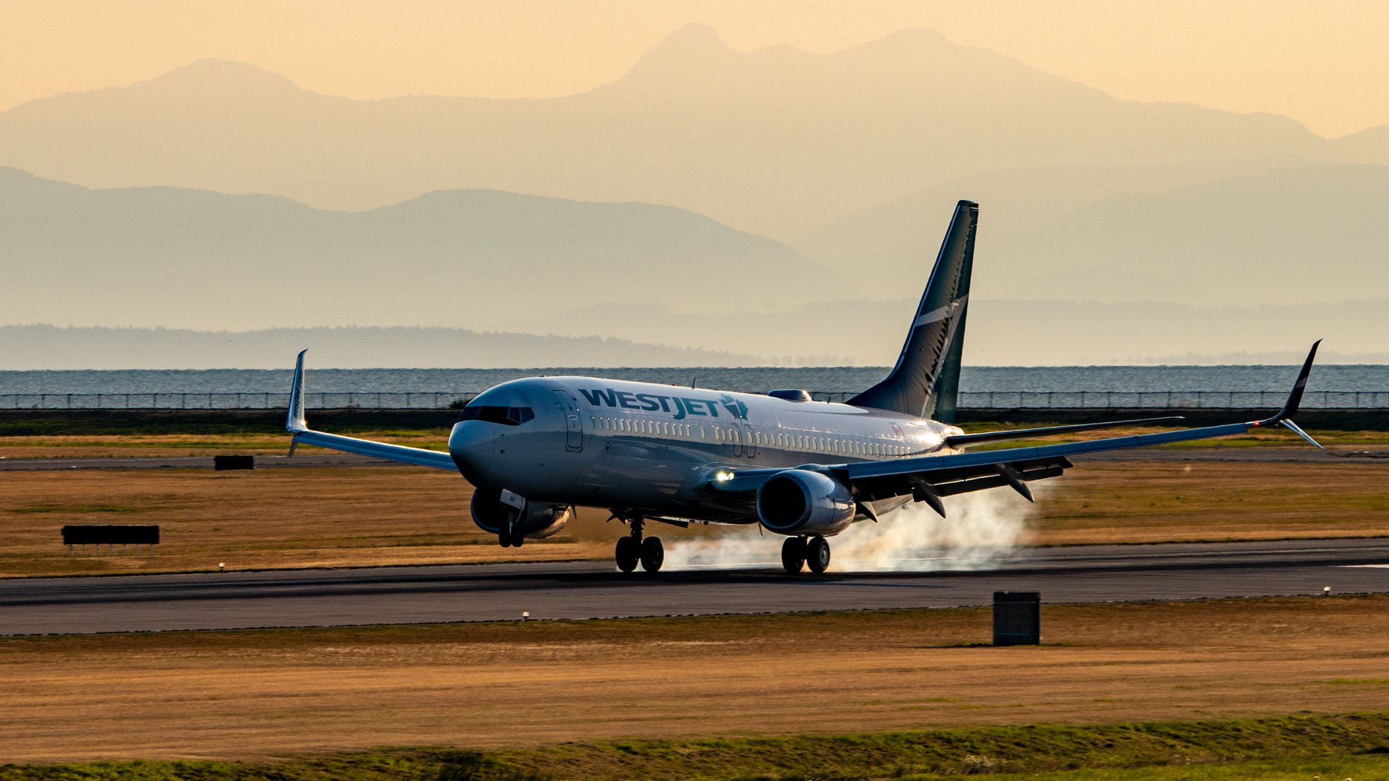 2MP_of_A 737-800 of WestJet Smokes the Mains in the YVR Sunset_01-1