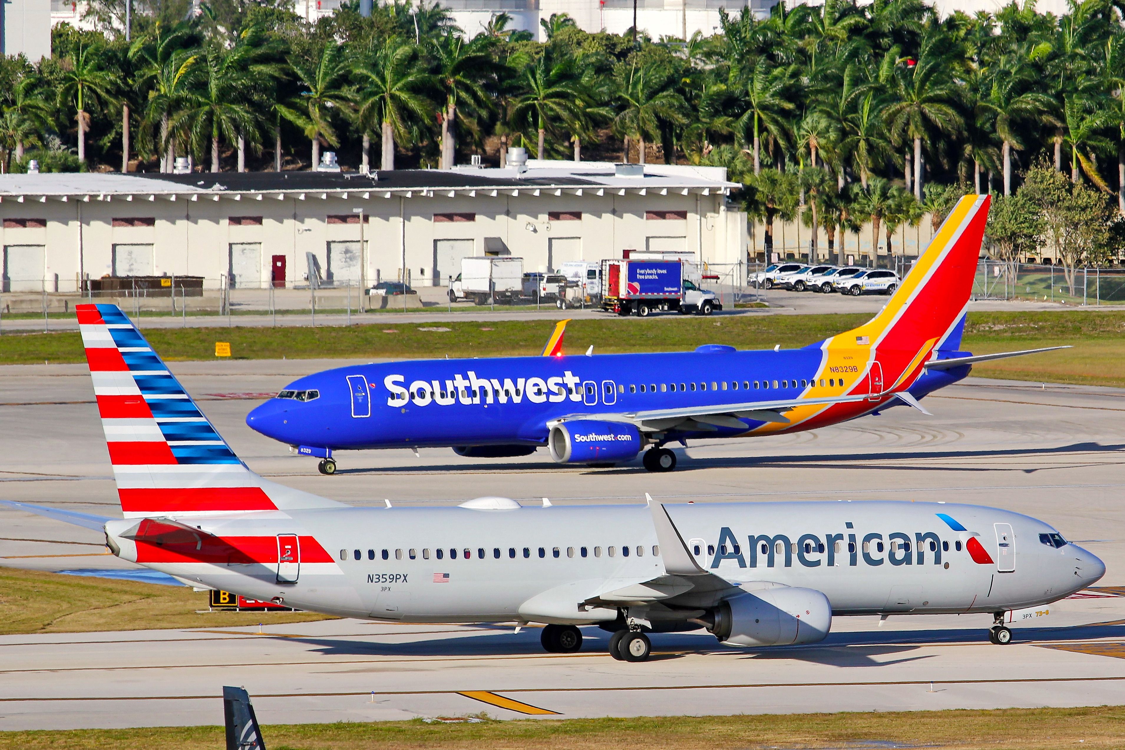 A Southwest Airlines 737 and an American Airlines 737 on the apron in Fort Lauderdale.
