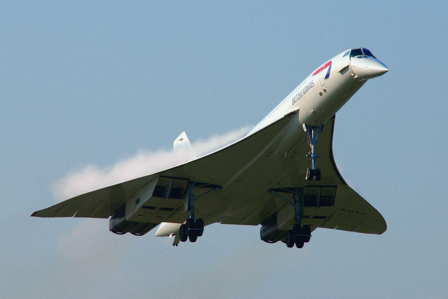 A British Airways Concorde flying in the sky.