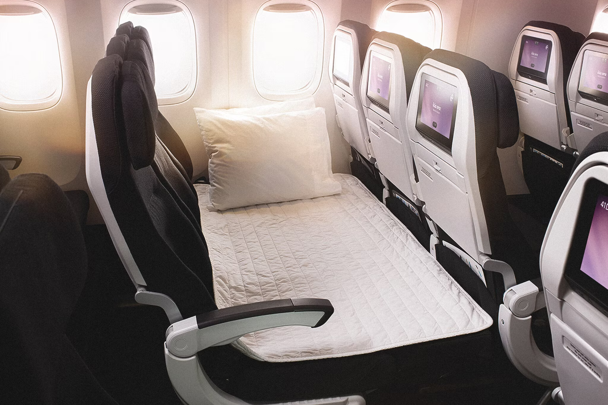 An Air New Zealand Skycouch set up for a passenger.