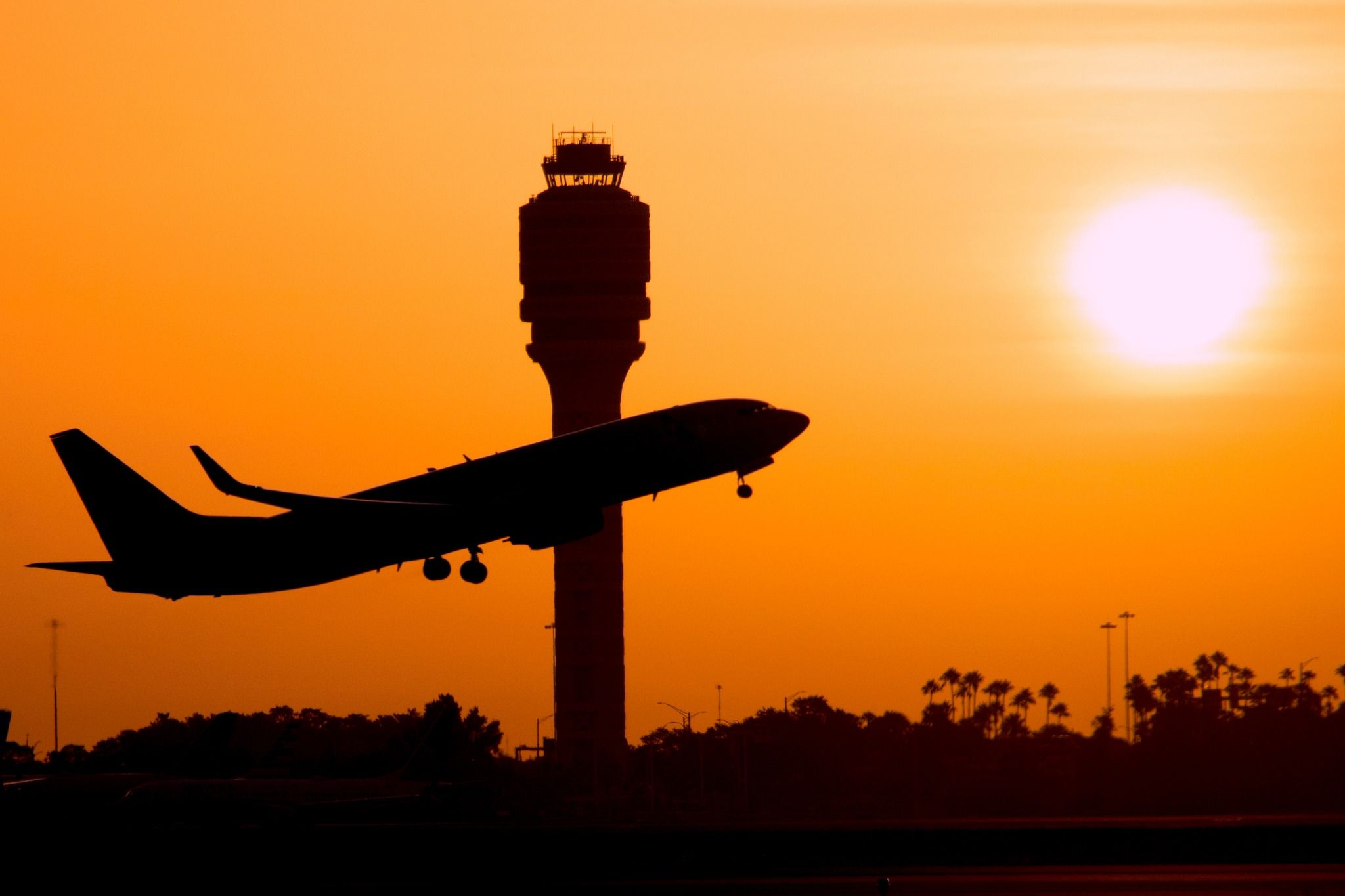 silhouette of a Boeing 737 taking off. 