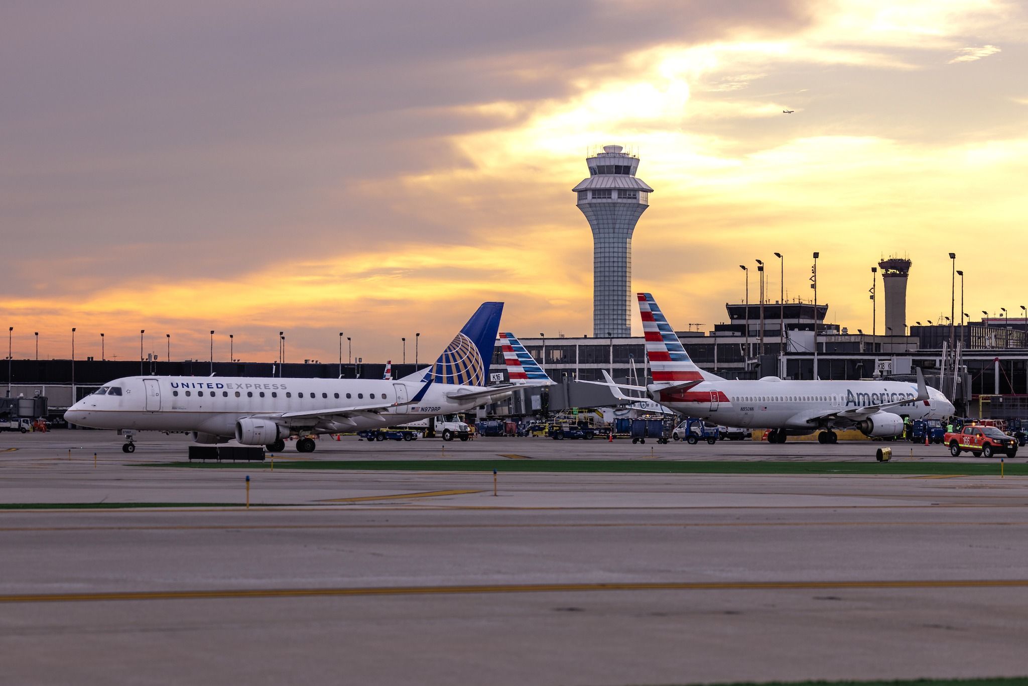 United Airlines and American Airlines aircraft at Chicago O'Hare International Airport.
